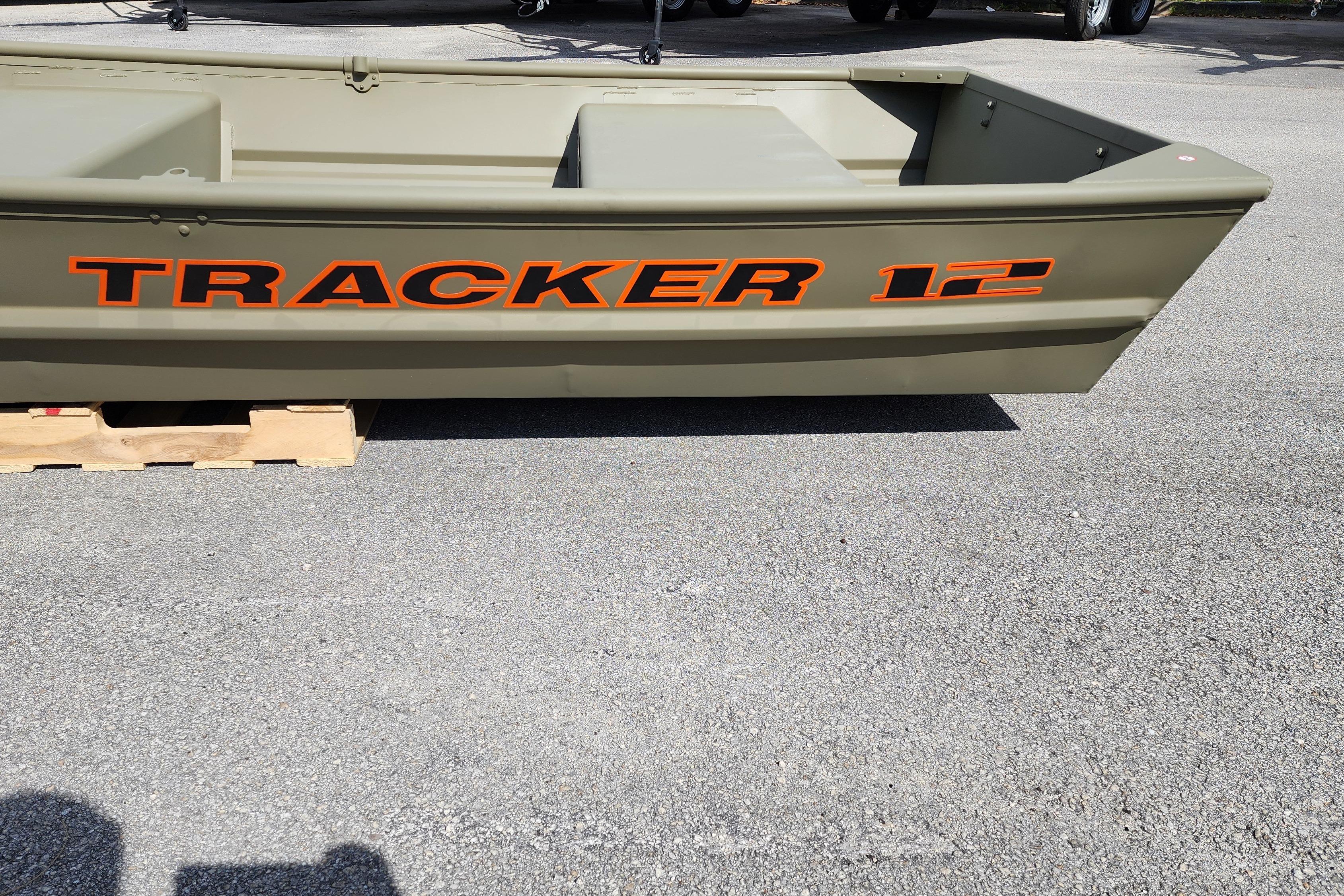 2026 Tracker Grizzly 12 Jon boat on display, featuring bold orange lettering.