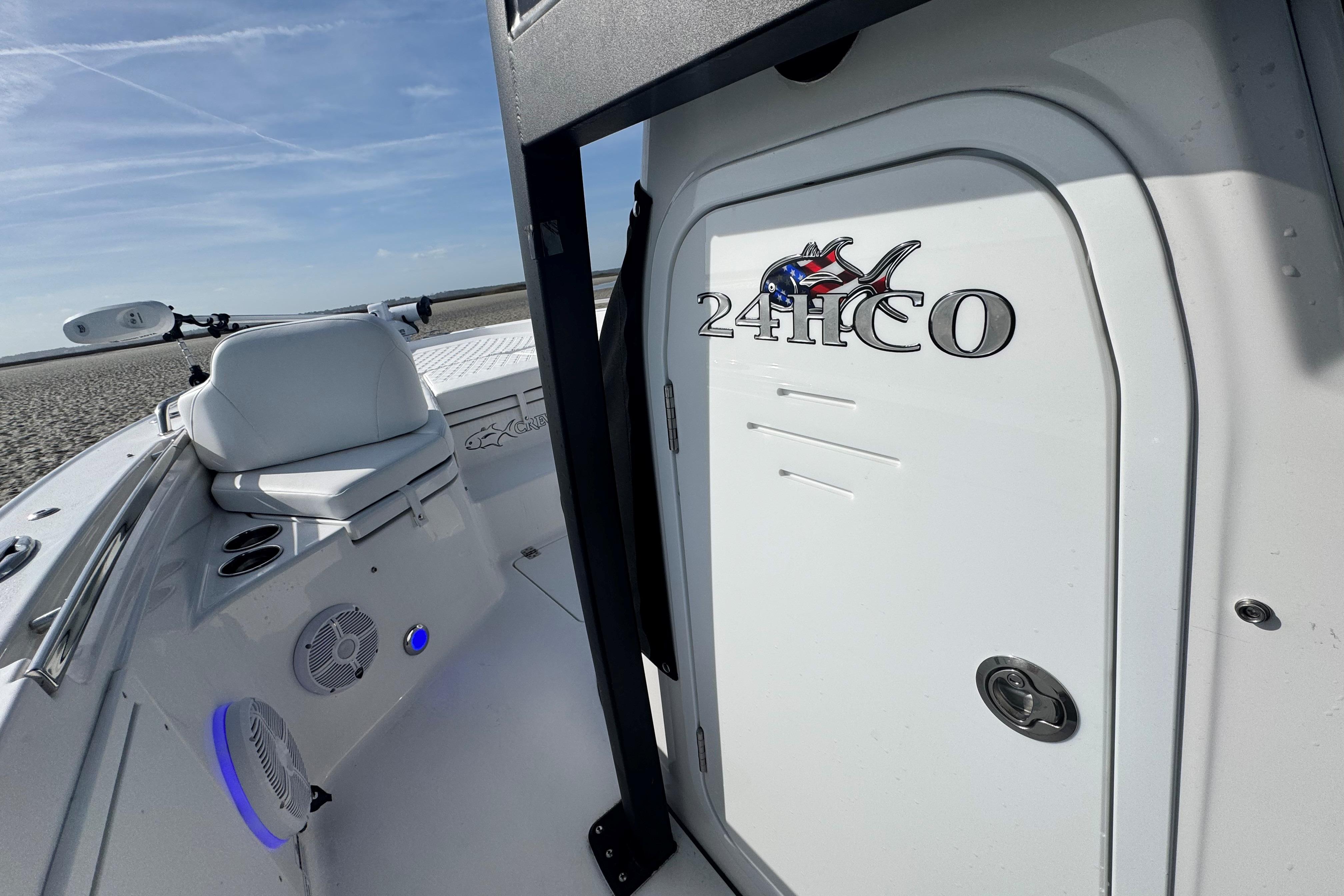 2025 Crevalle 24 HCO boat interior with seating and storage compartment.