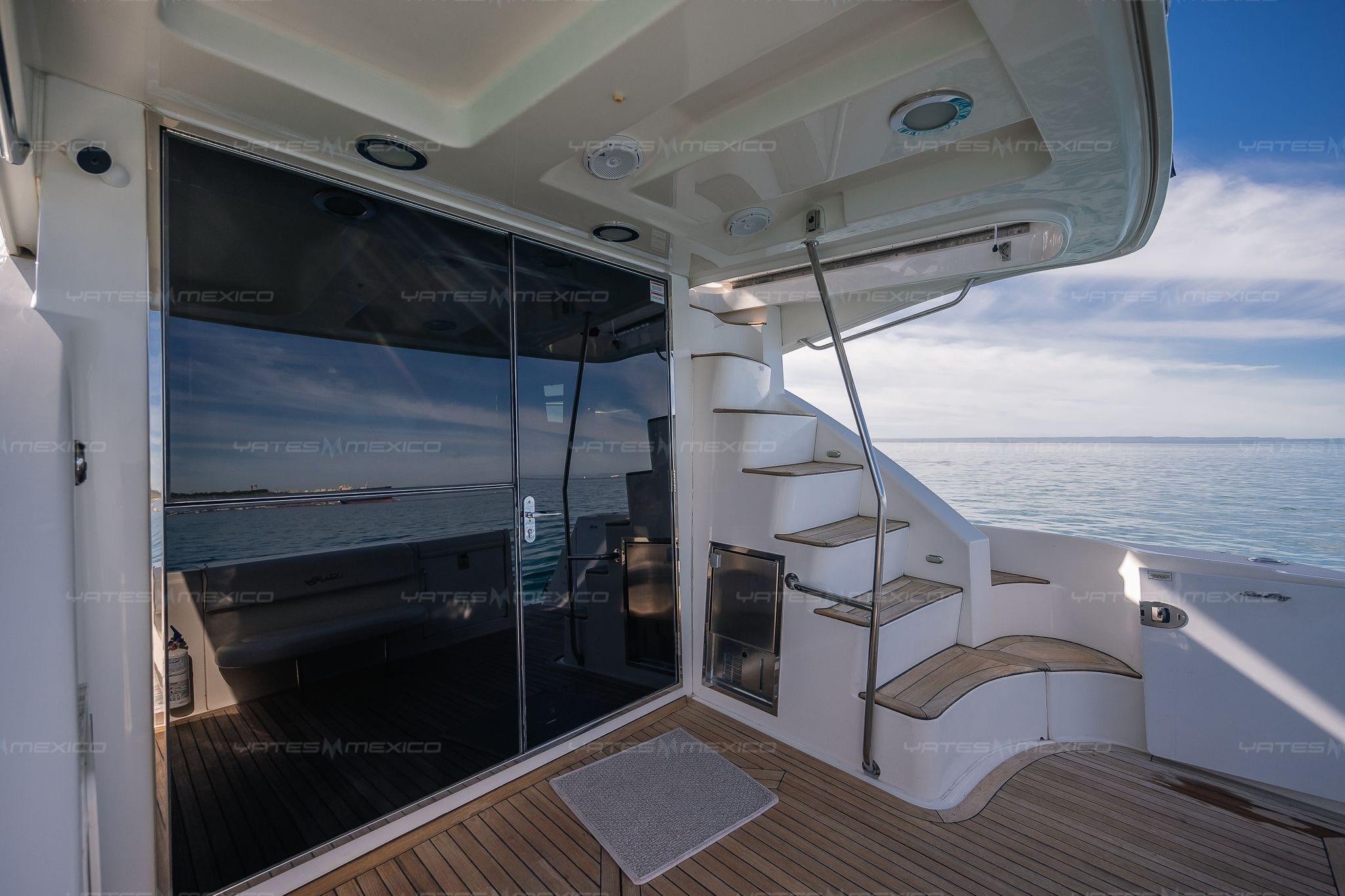 2008 Sea Ray 480 Sedan Bridge yacht with elegant deck and spiral staircase.