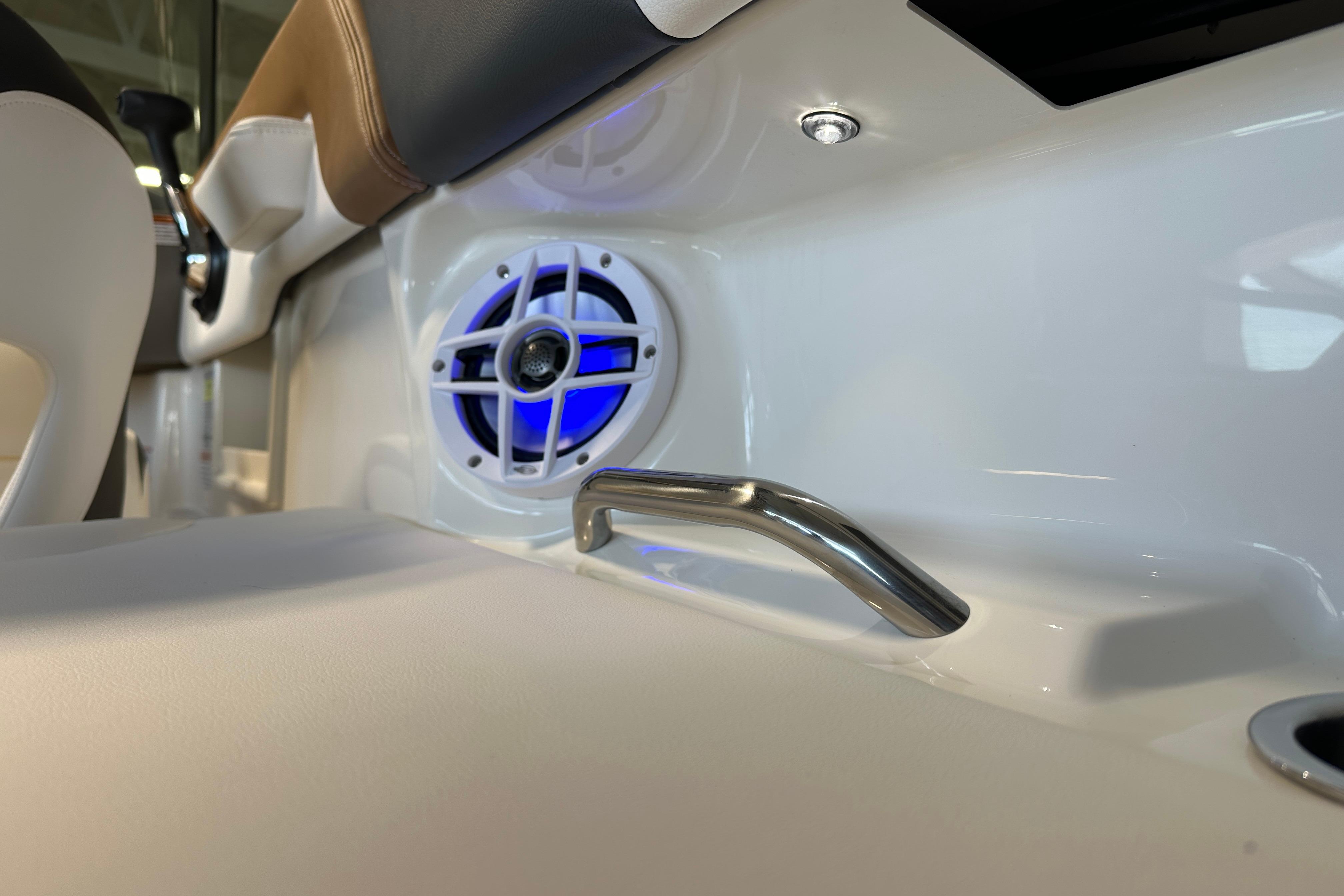 Interior of 2026 Chaparral 23 SSi with speaker and handle.