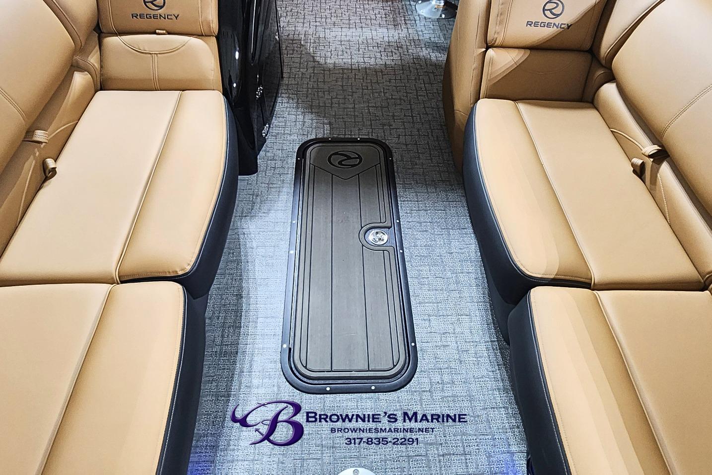 Luxurious interior of 2026 Regency 250 DL boat with tan leather seating.