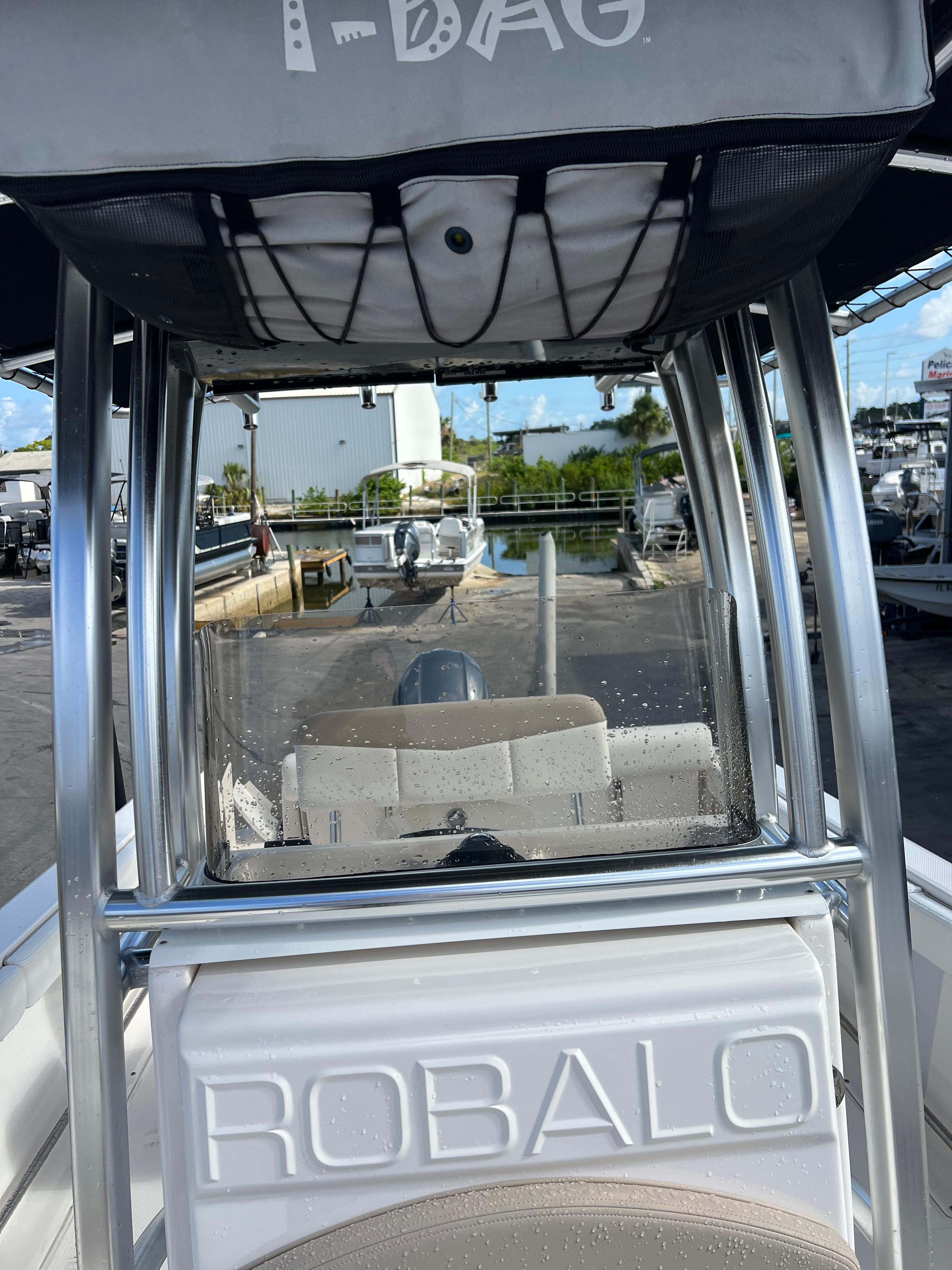 2022 Robalo R222 Center Console boat with T-top and wet windshield.