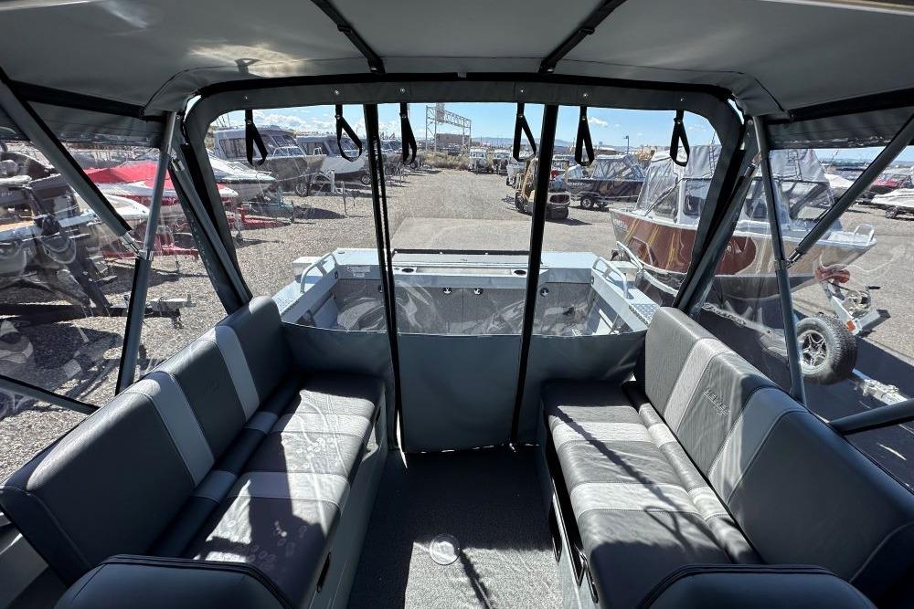 Interior view of 2026 Hewescraft 180 ProV ET boat with seating and windows.