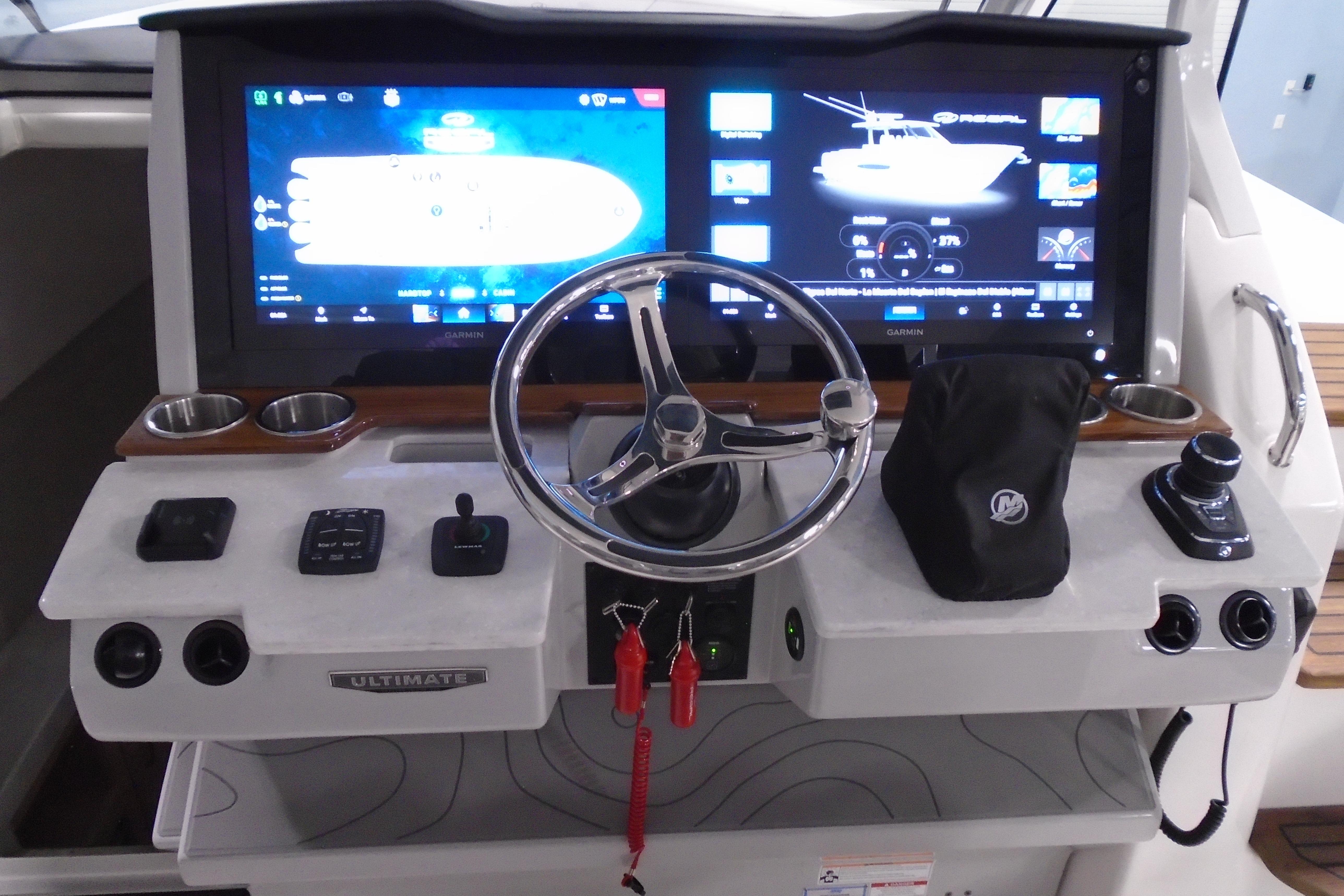 Cockpit of 2026 Regal 38 SAV boat with advanced navigation displays and controls.