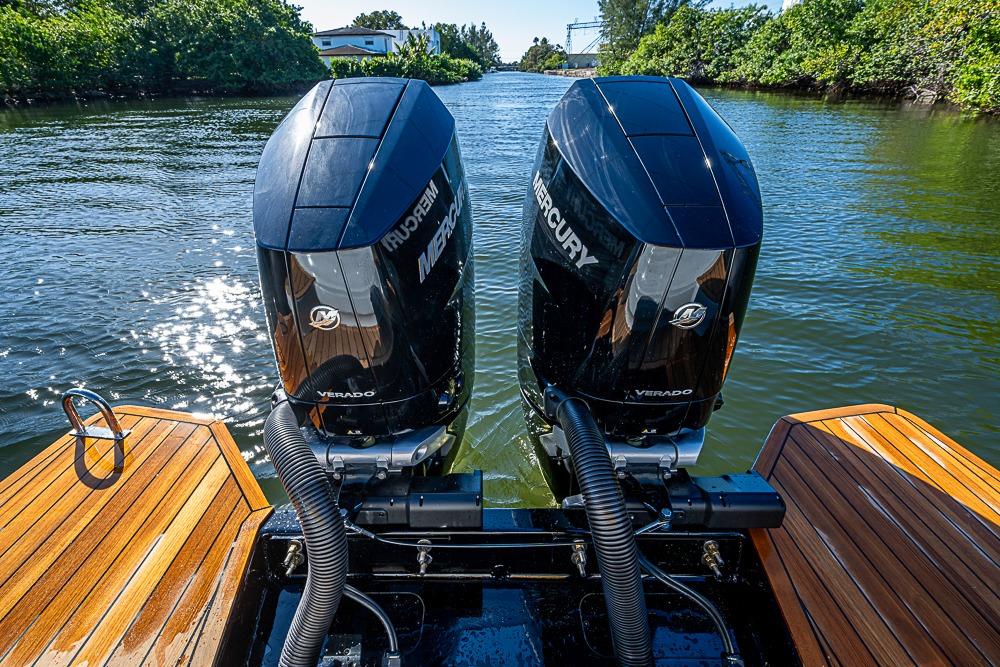 2025 SACS Strider 11 with dual Mercury Verado engines on a sunny waterway.