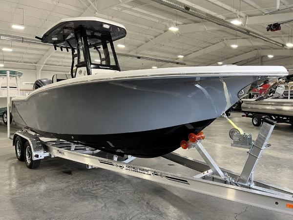 2023 Tidewater 232 CC Adventure boat on trailer in warehouse.