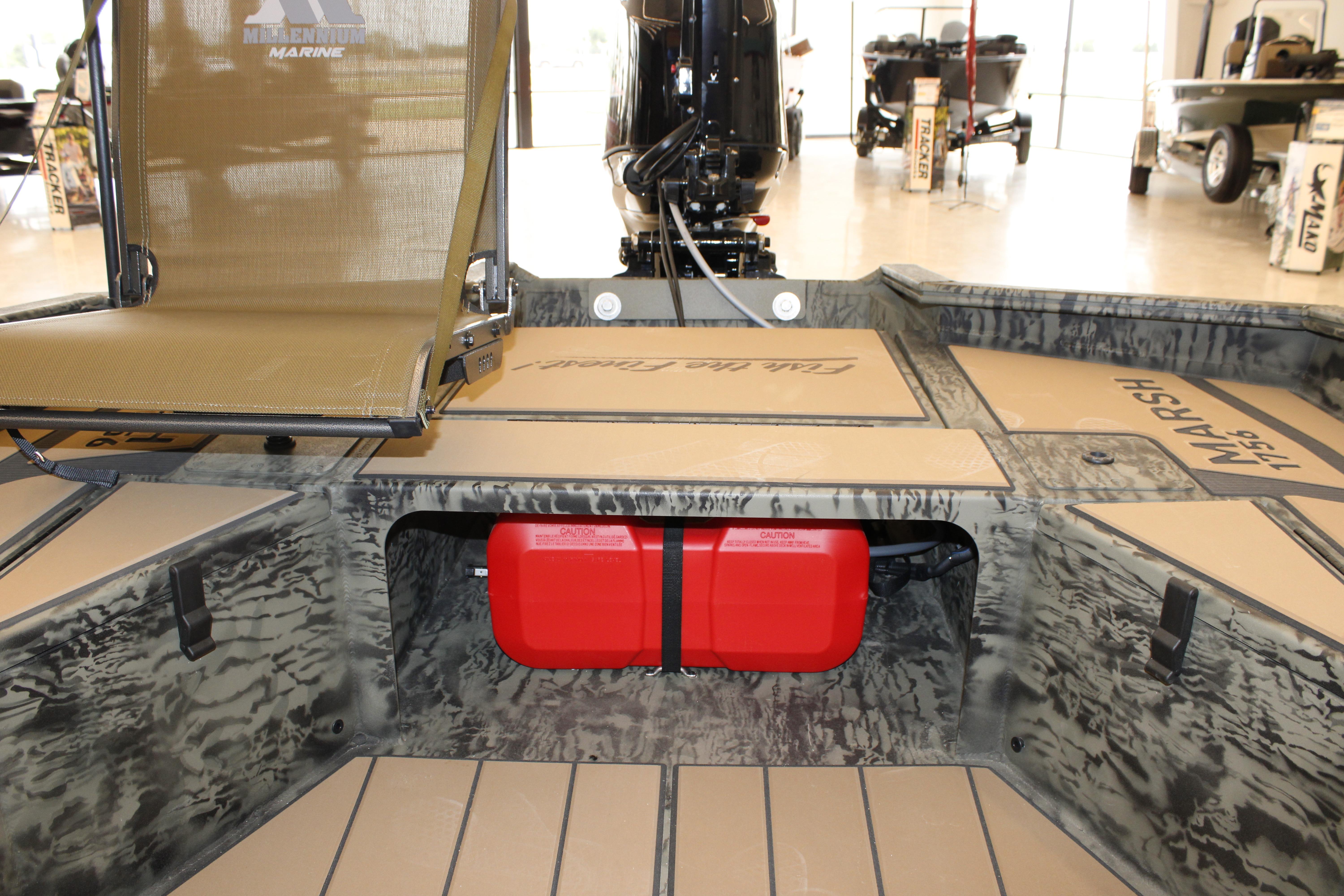 2026 Tracker Grizzly 1756 T Marsh boat interior with camouflage design and red fuel tank.
