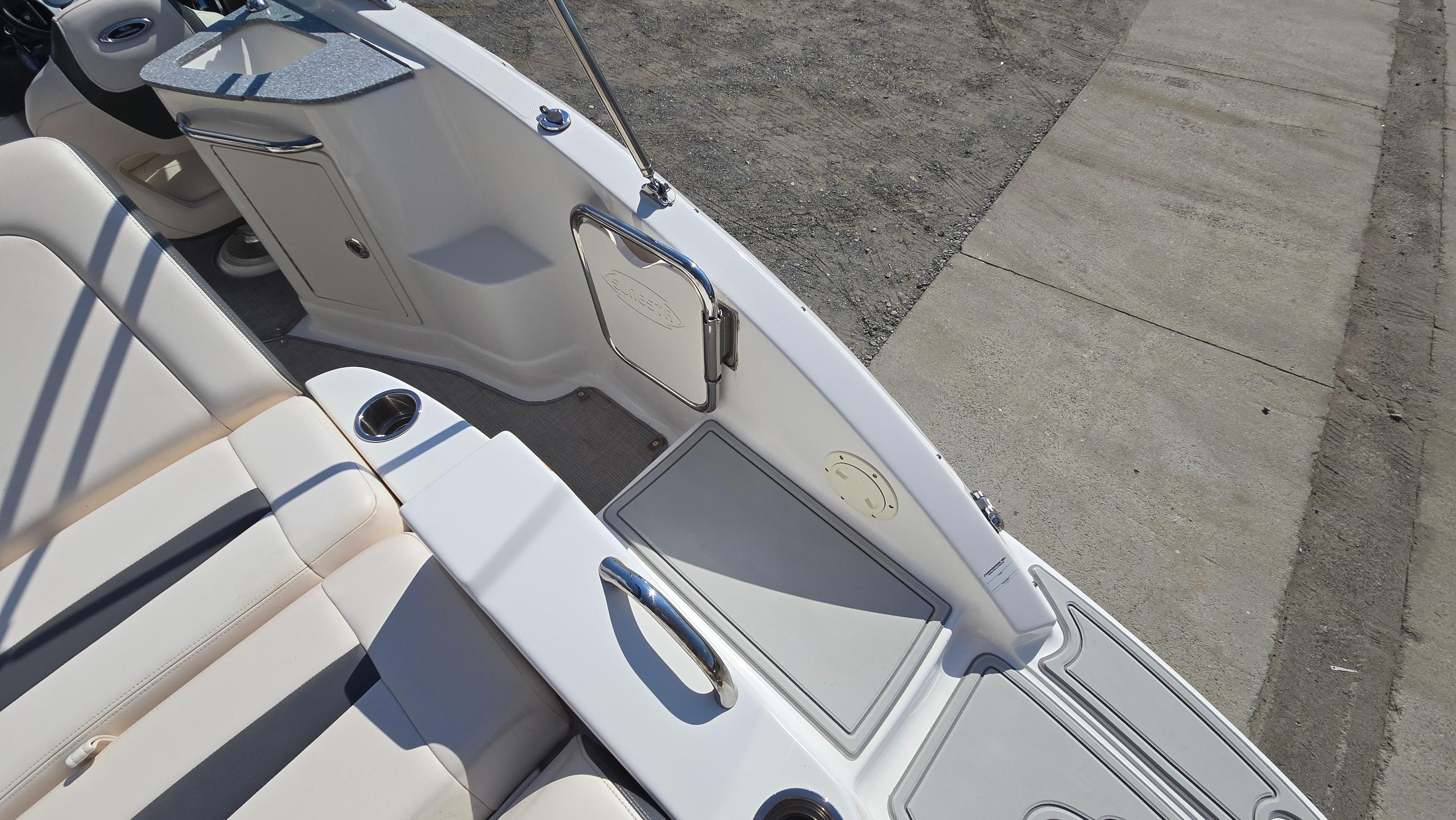 2018 Chaparral 224 Sunesta boat interior with seating and storage compartments.