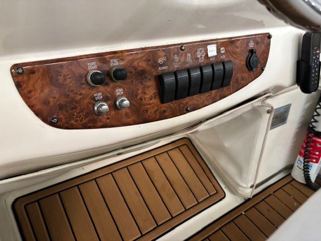 Close-up of a 2004 Meridian 341 Sedan helm with wood accents.