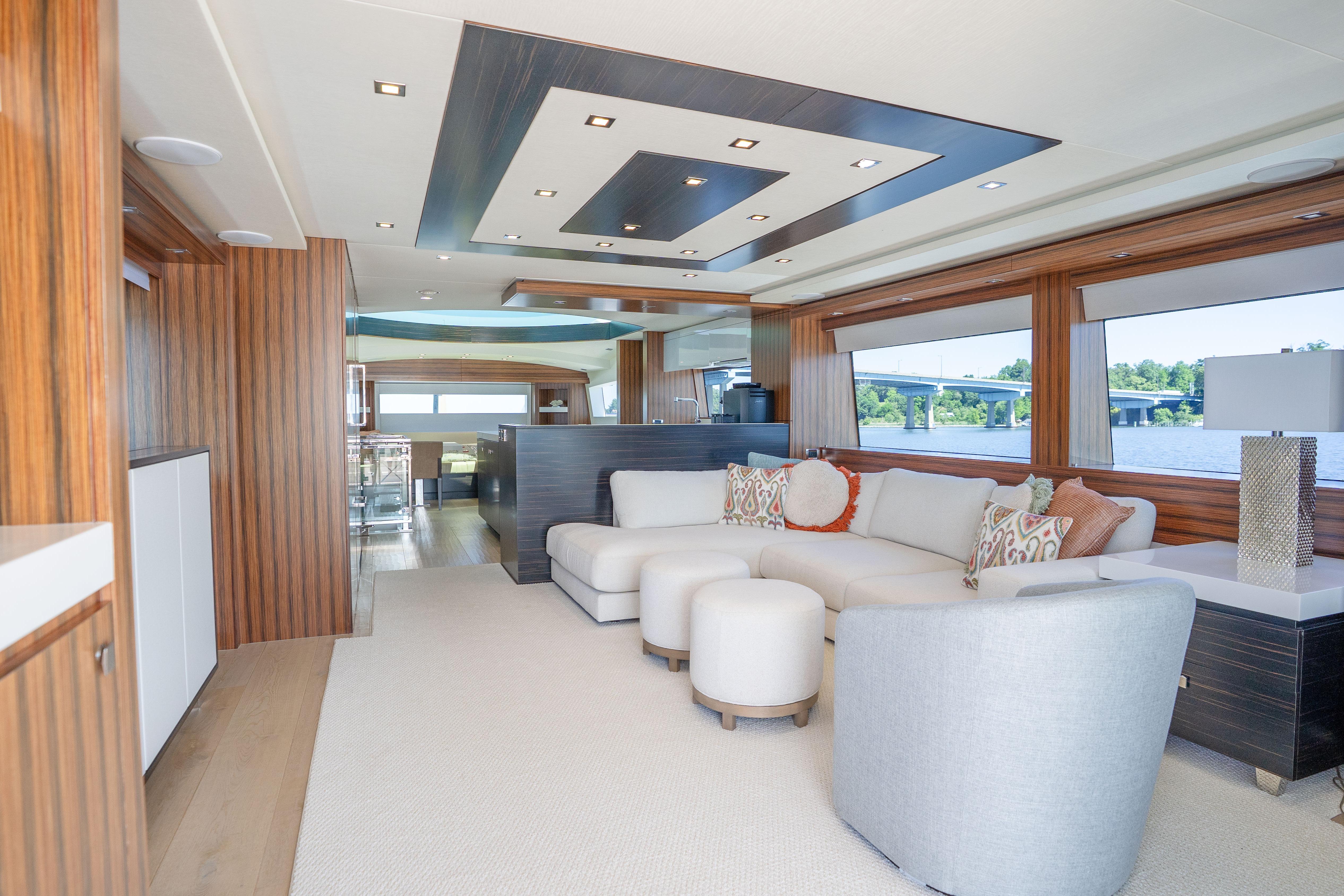 Luxurious interior of 2021 Hatteras M75 Panacera yacht with modern design and spacious seating.