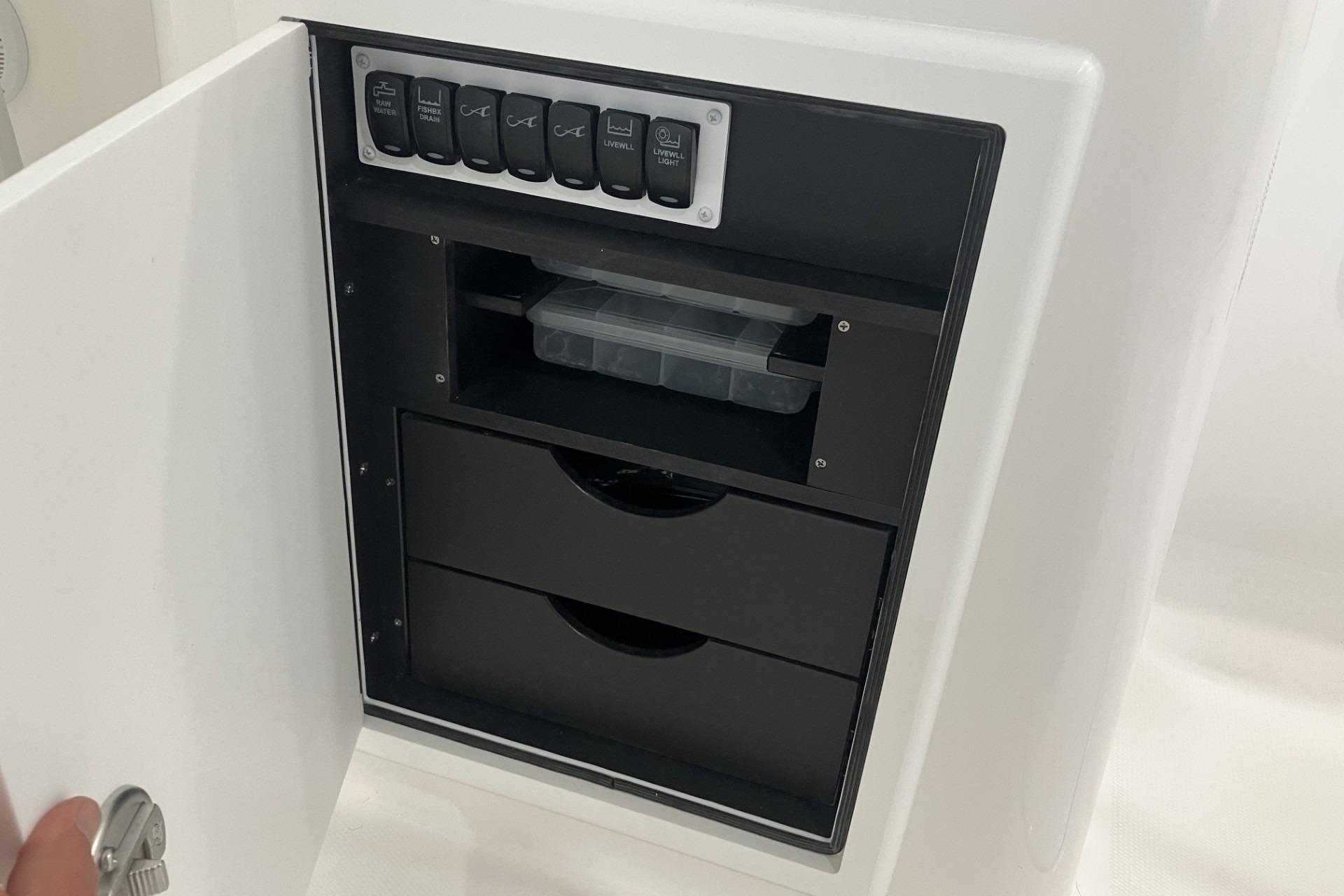 Control panel and storage compartment on 2026 Albemarle 27 Dual Console boat.