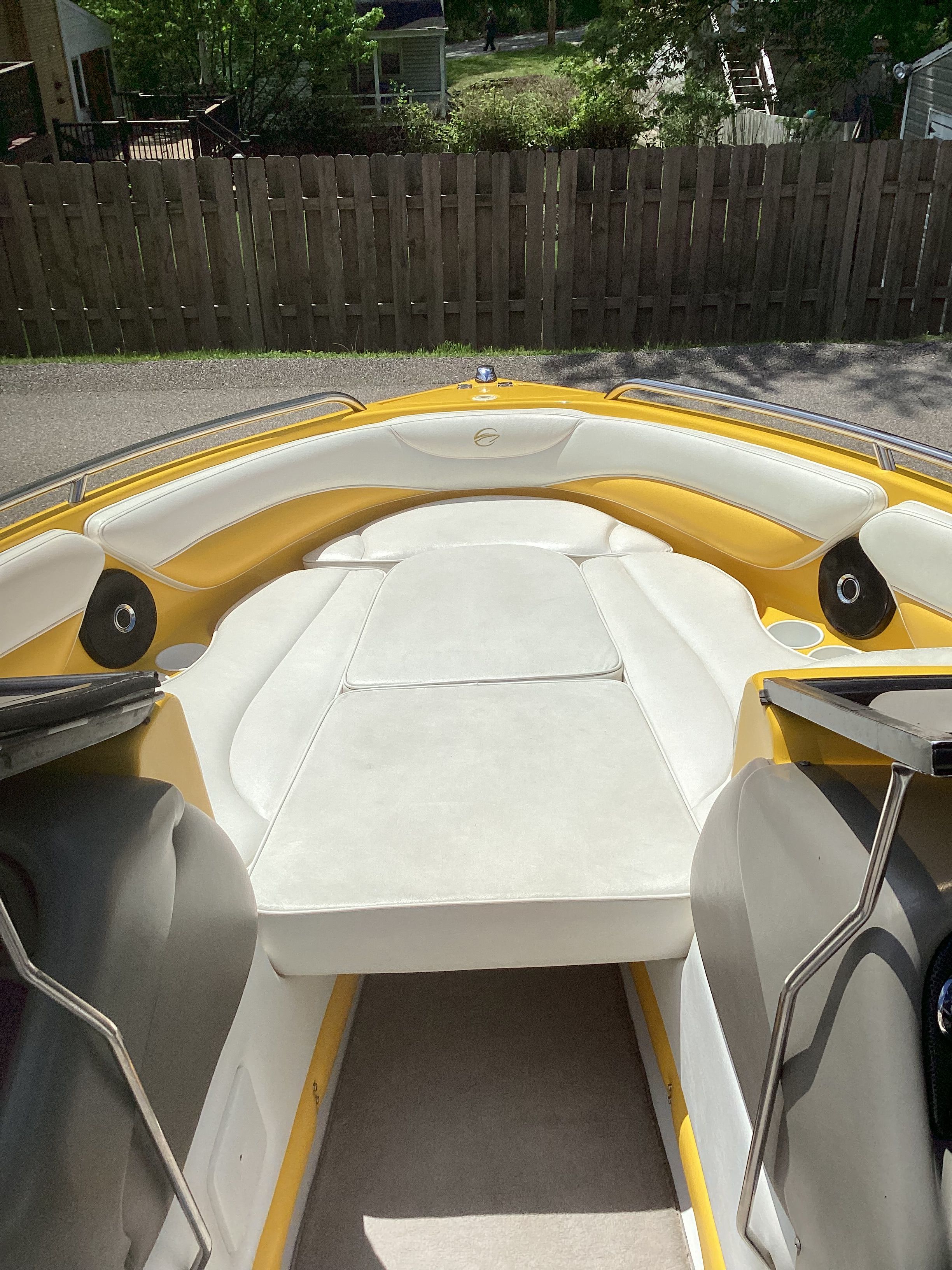 Interior of a 2005 Crownline 202 BR LPX boat, yellow and white design.