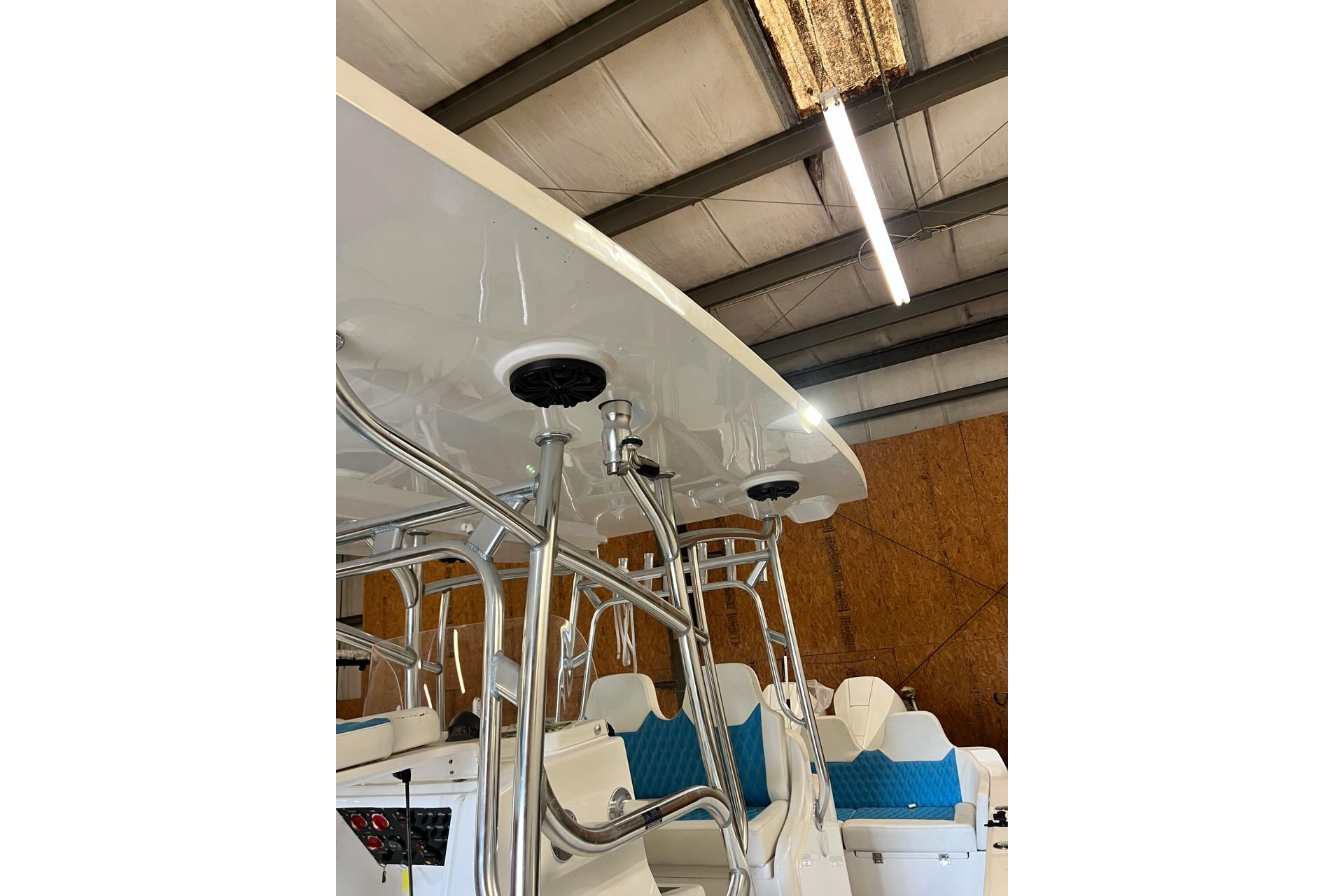 2021 Custom Infusion 34 CC boat interior with blue seating and metal framework.