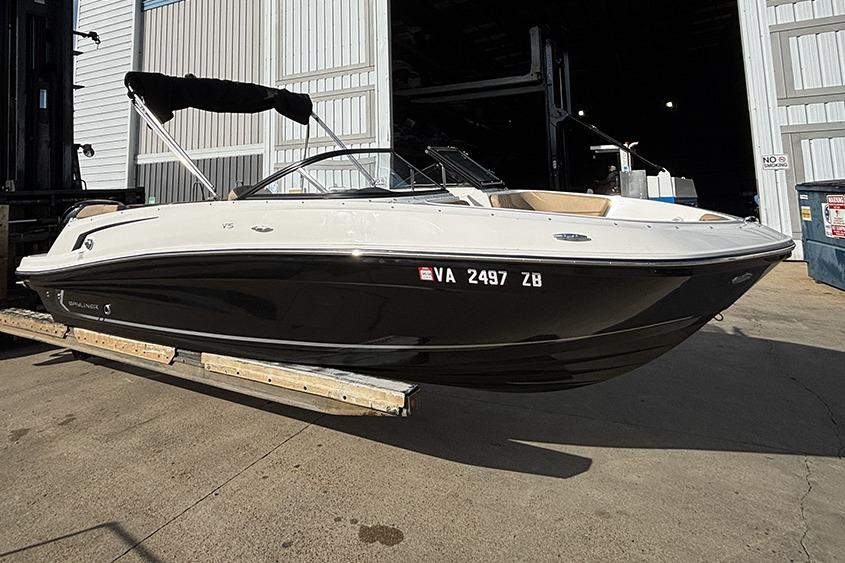 2023 Bayliner VR5 Bowrider OB boat in a marina setting.