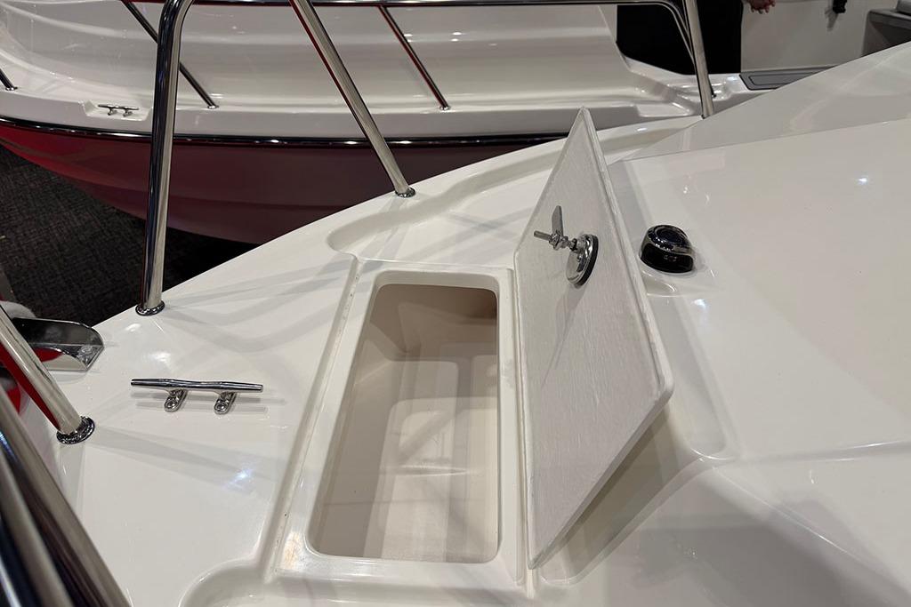 Open storage compartment on 2027 Arima Sea Ranger 21 Yellowtail Edition boat deck.
