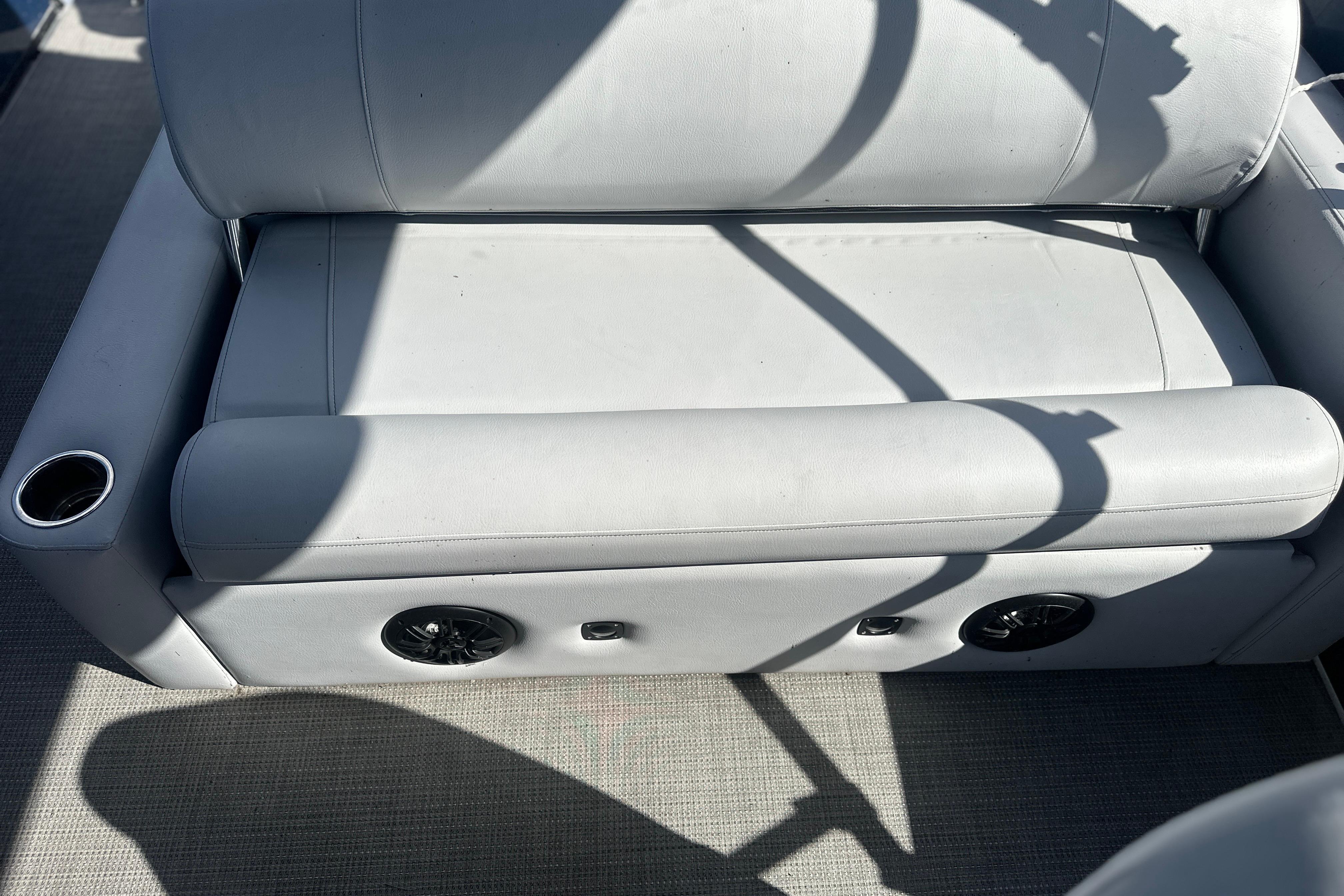 2023 Bentley Pontoons Legacy 243 Swingback seat with cup holder and speaker.