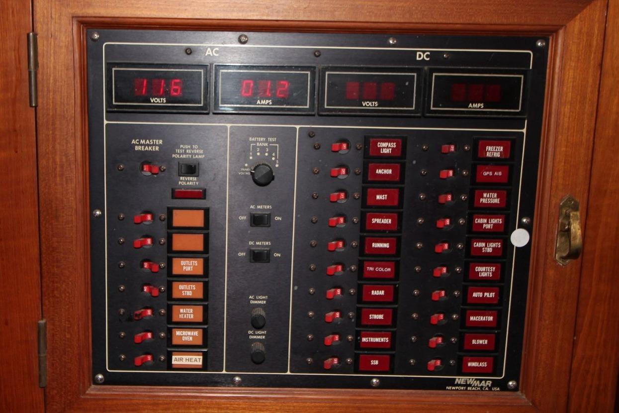 Electrical control panel with AC/DC meters and switches, Passport 47, 1985 model.