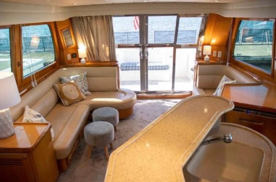 Luxurious interior of 2005 McKinna 57 Pilothouse yacht with elegant seating and modern design.