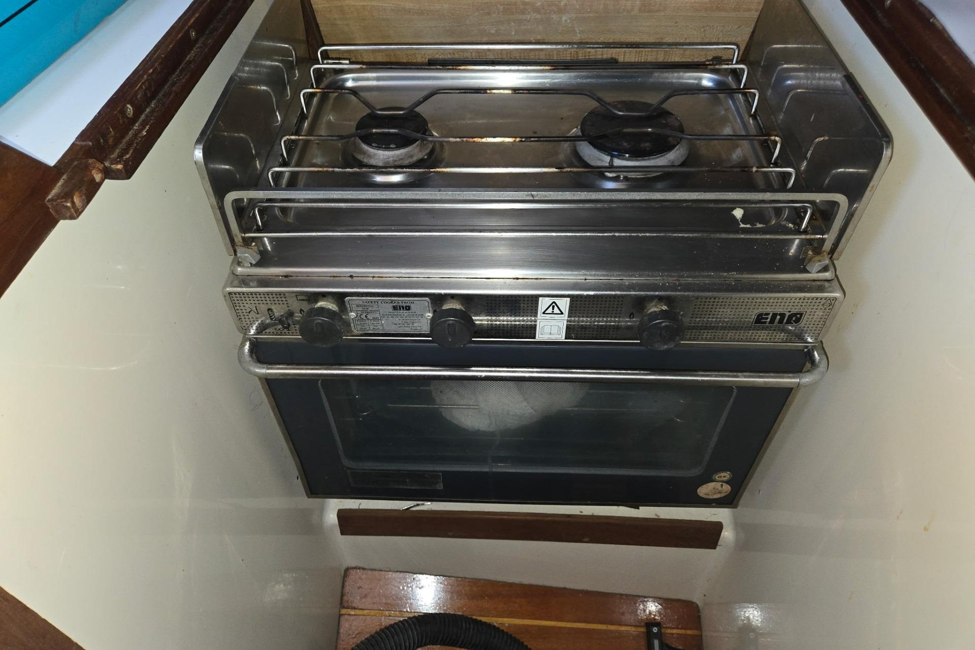 Compact stove and oven in a 1981 Sea Sprite 34 sailboat galley.