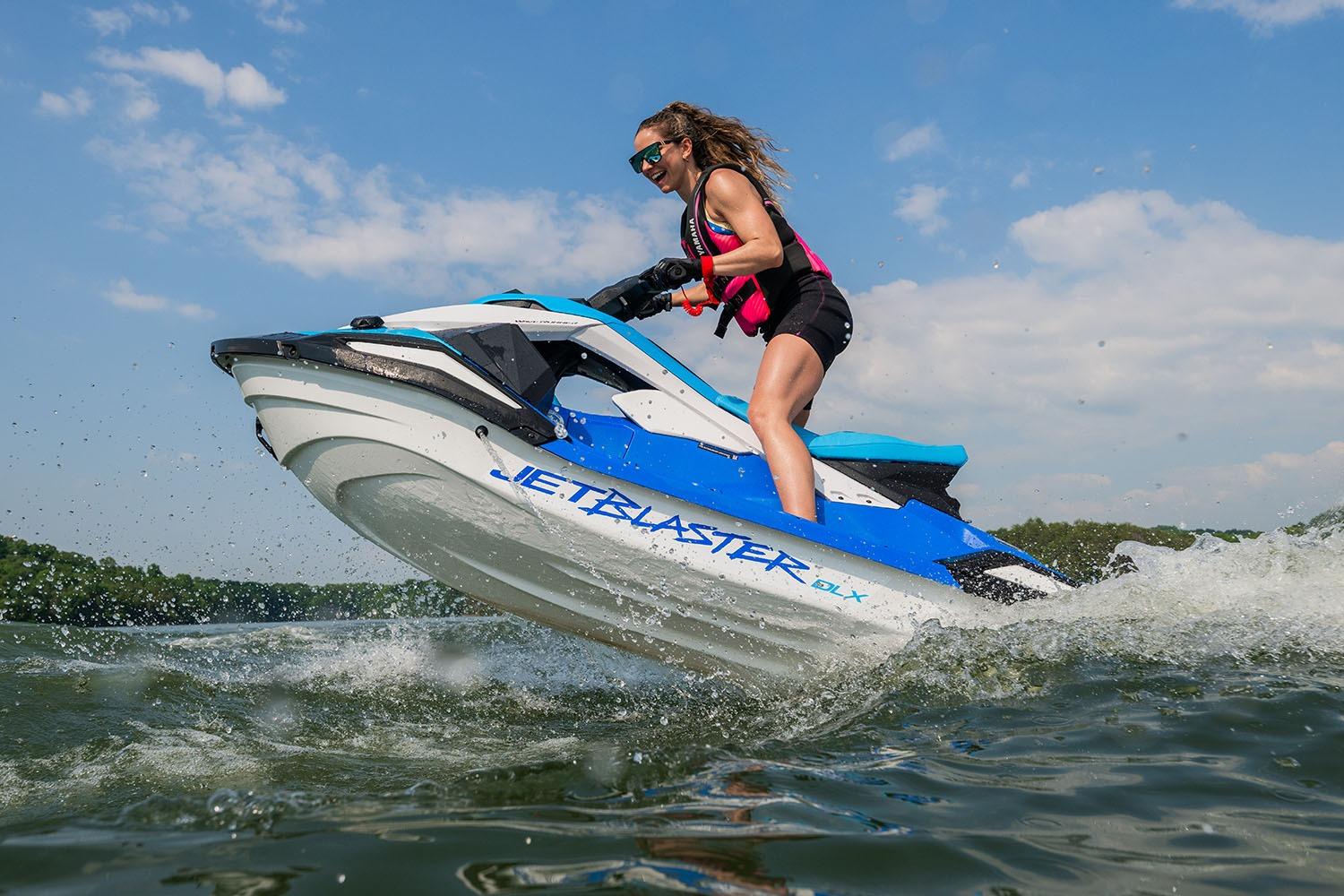 Manufacturer Provided Image: 2026 Yamaha WaveRunner JetBlaster DLX 3-Up on water, rider in action.