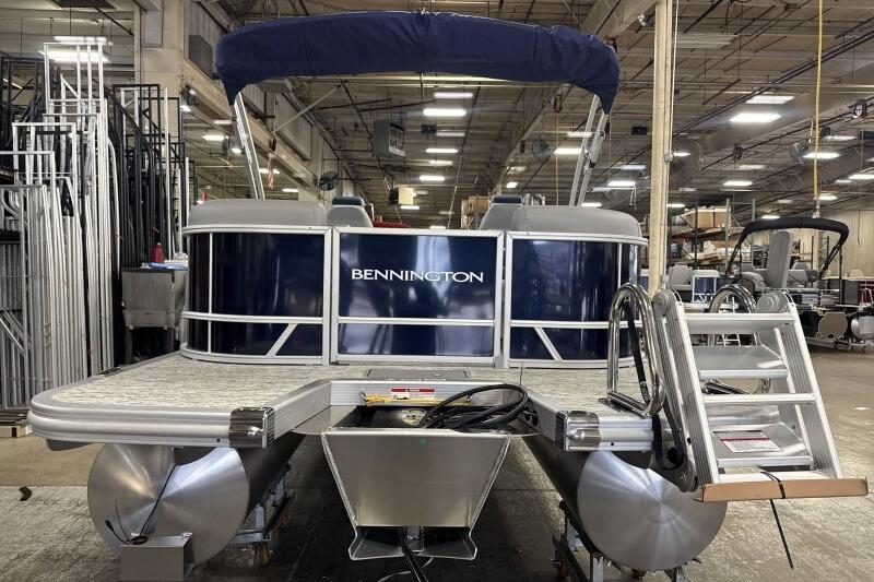 2026 Bennington 23 SSRSF pontoon boat in a warehouse setting.
