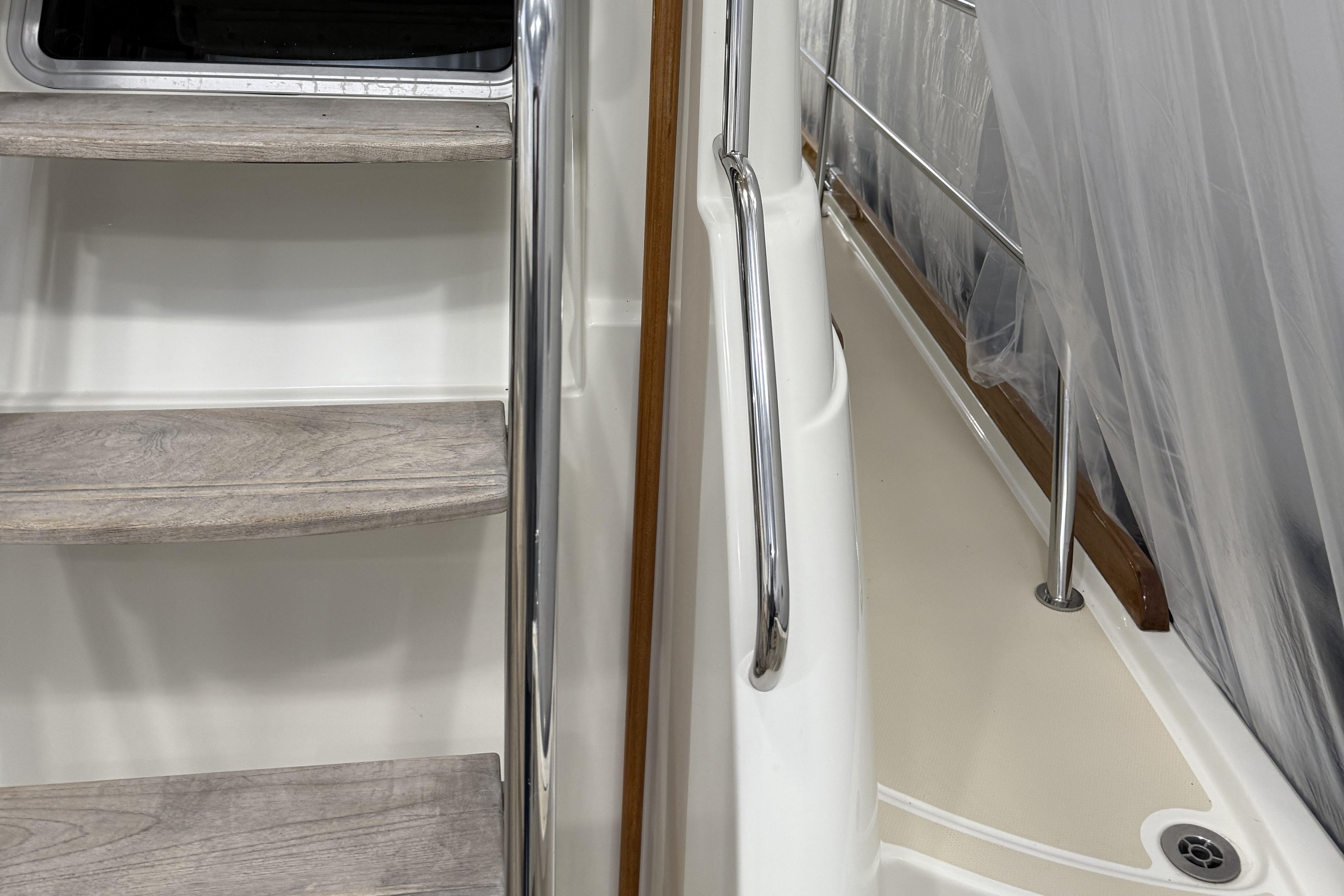 Staircase and railing on 2021 Sabre 42 Fly Bridge yacht interior.