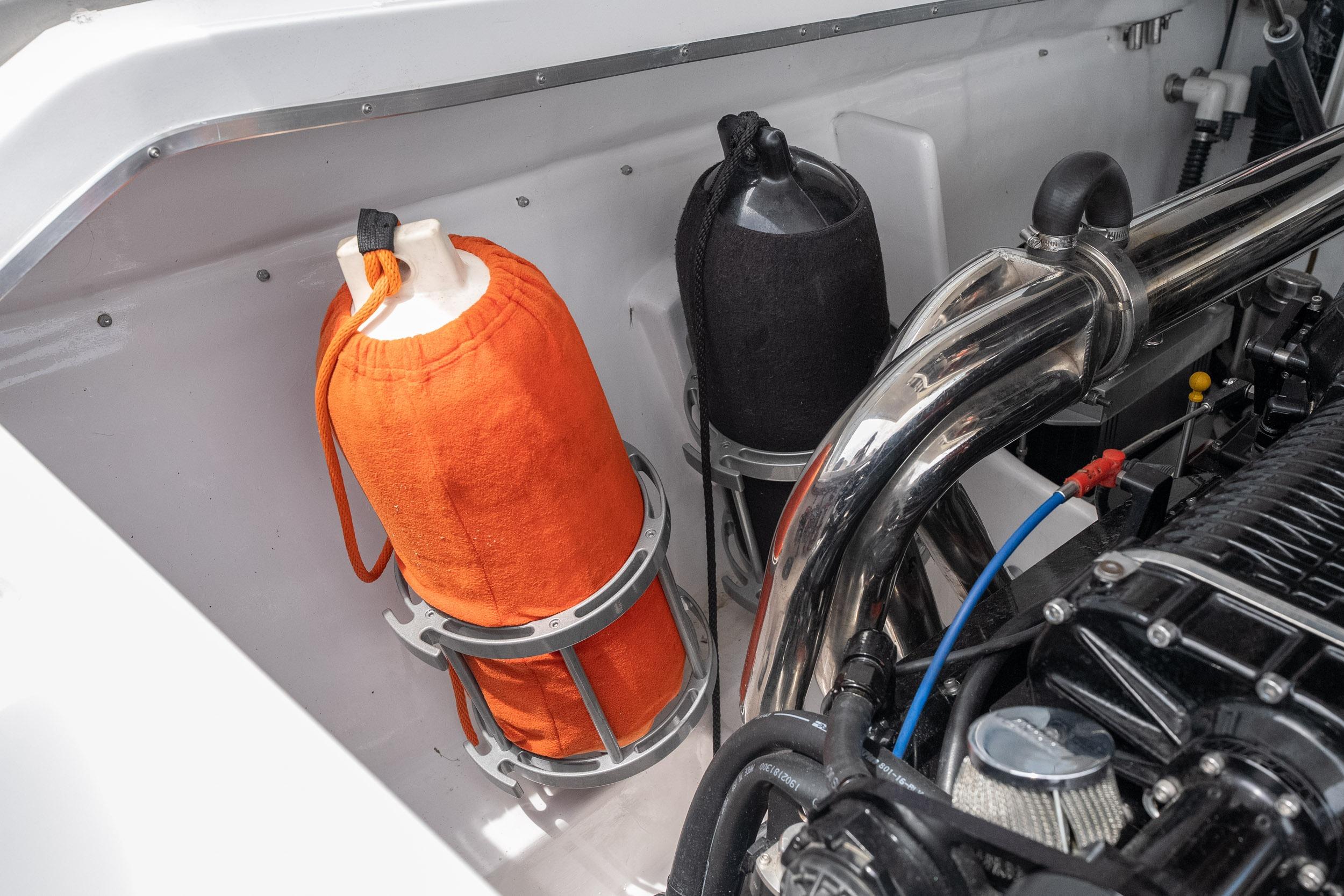 Engine compartment of a 2006 Cigarette 39' Top Gun Unlimited boat with visible components.