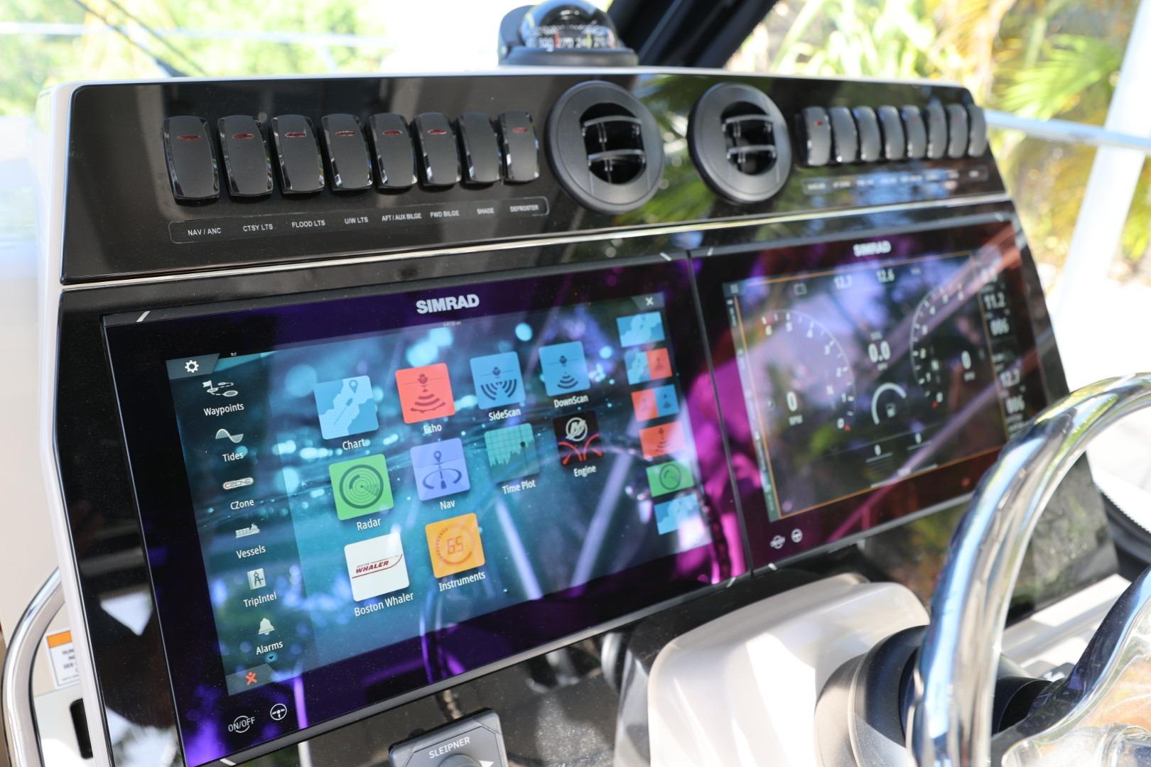 2025 Boston Whaler 325 Conquest dashboard with advanced Simrad navigation system.