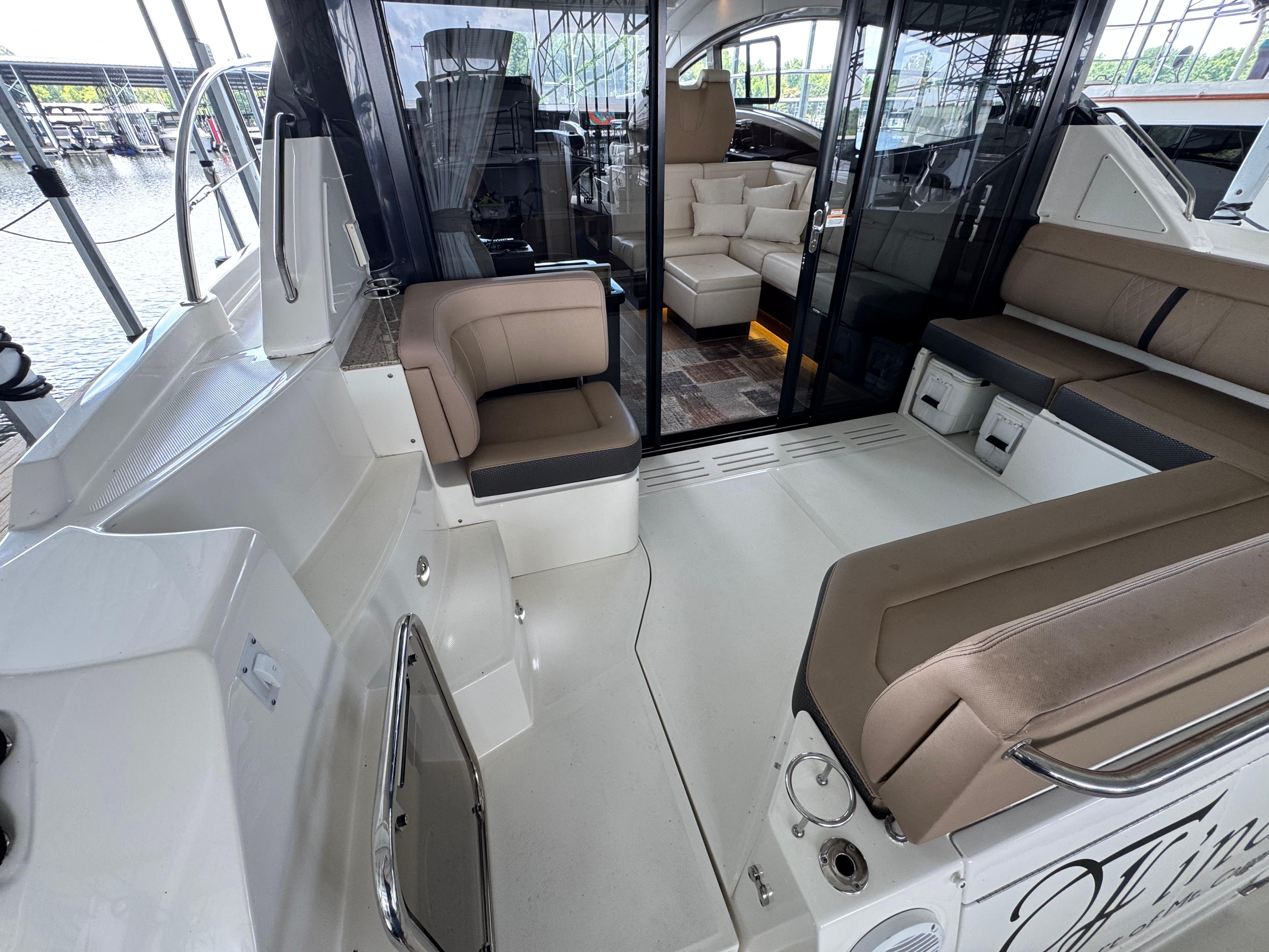 2017 Sea Ray Sundancer 400 yacht interior with seating and glass doors.