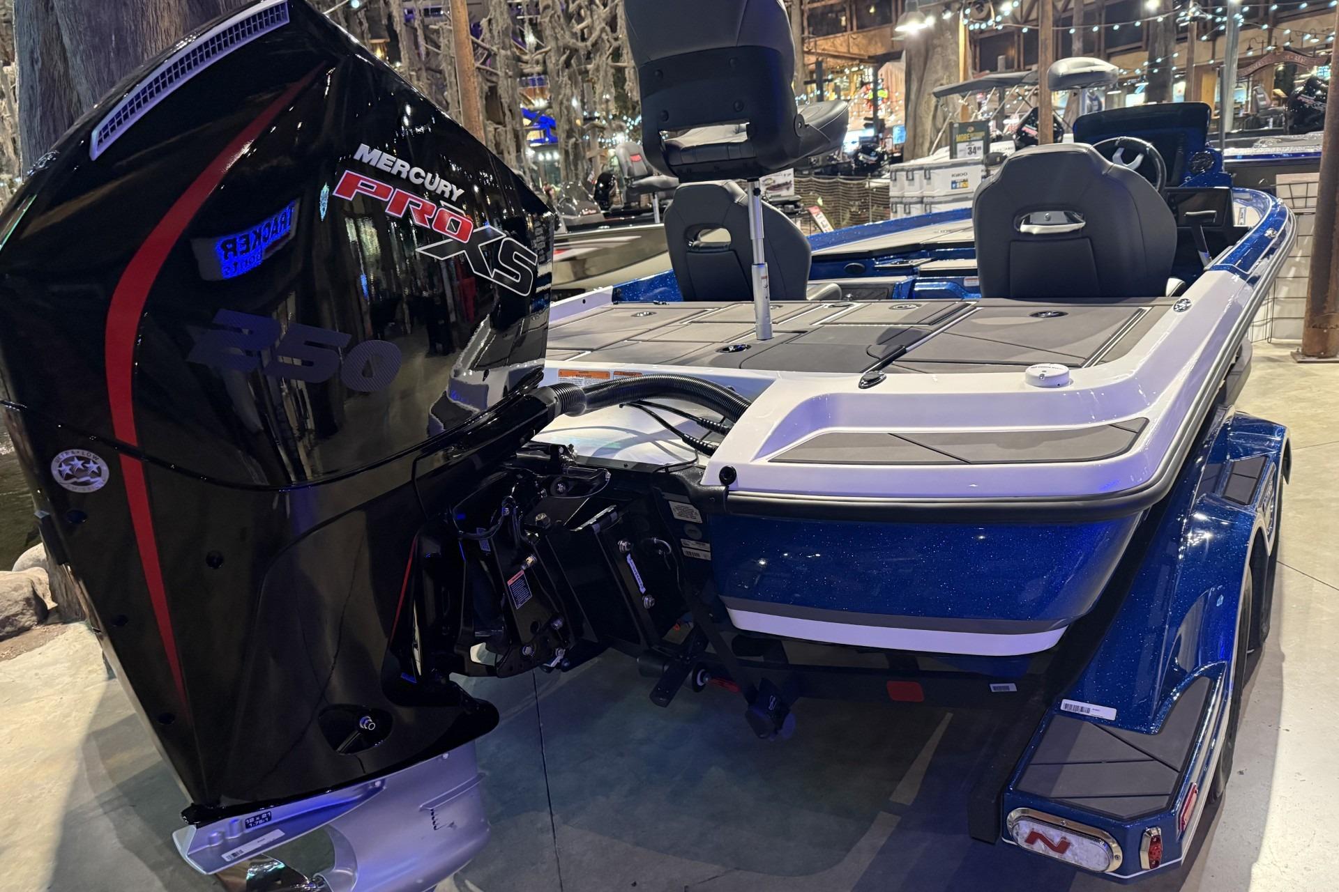 2026 Nitro Z21 XL Pro boat with Mercury Pro XS 250 engine in showroom.