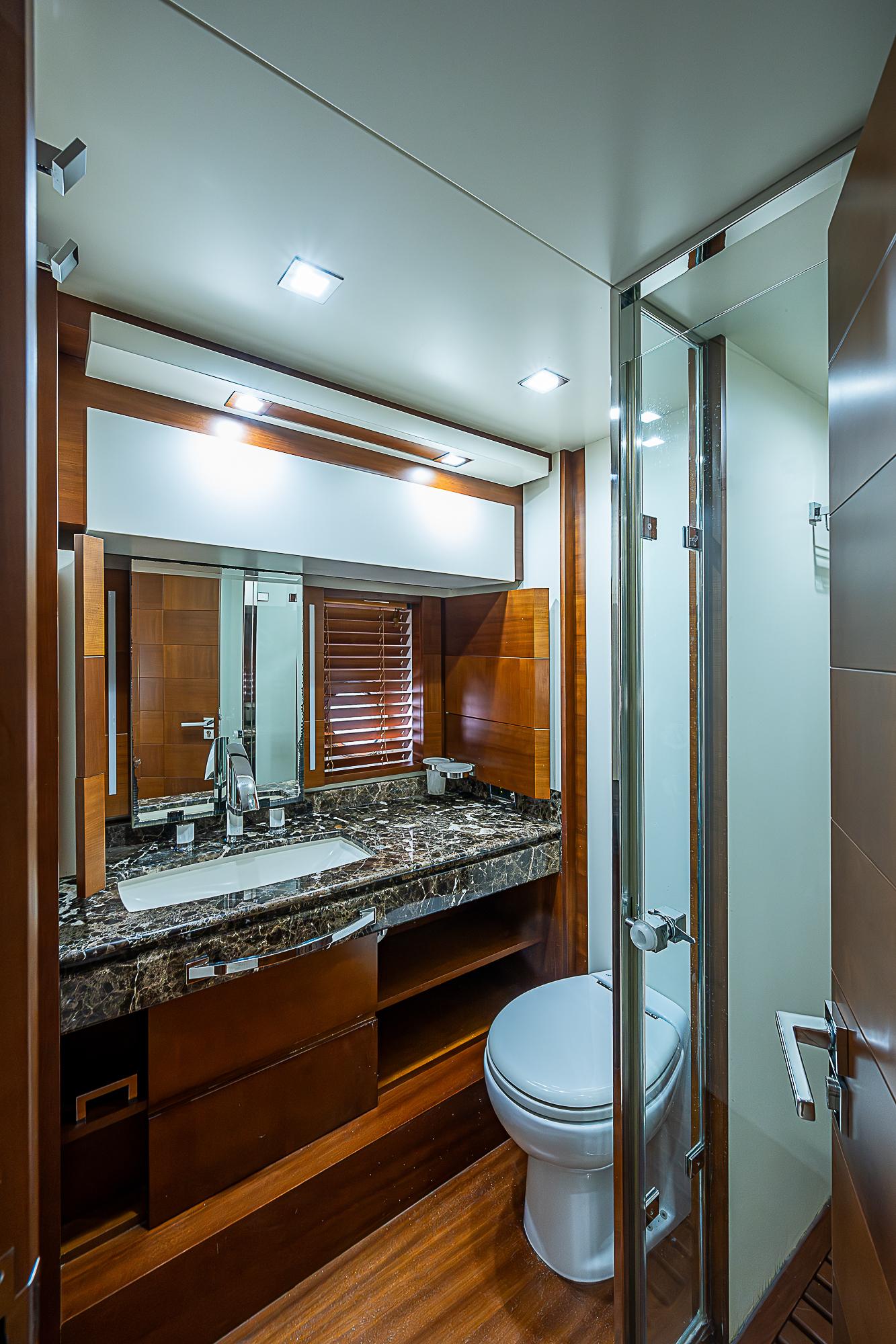 Luxurious bathroom in 2011 Azimut 82 yacht with modern fixtures and elegant design.