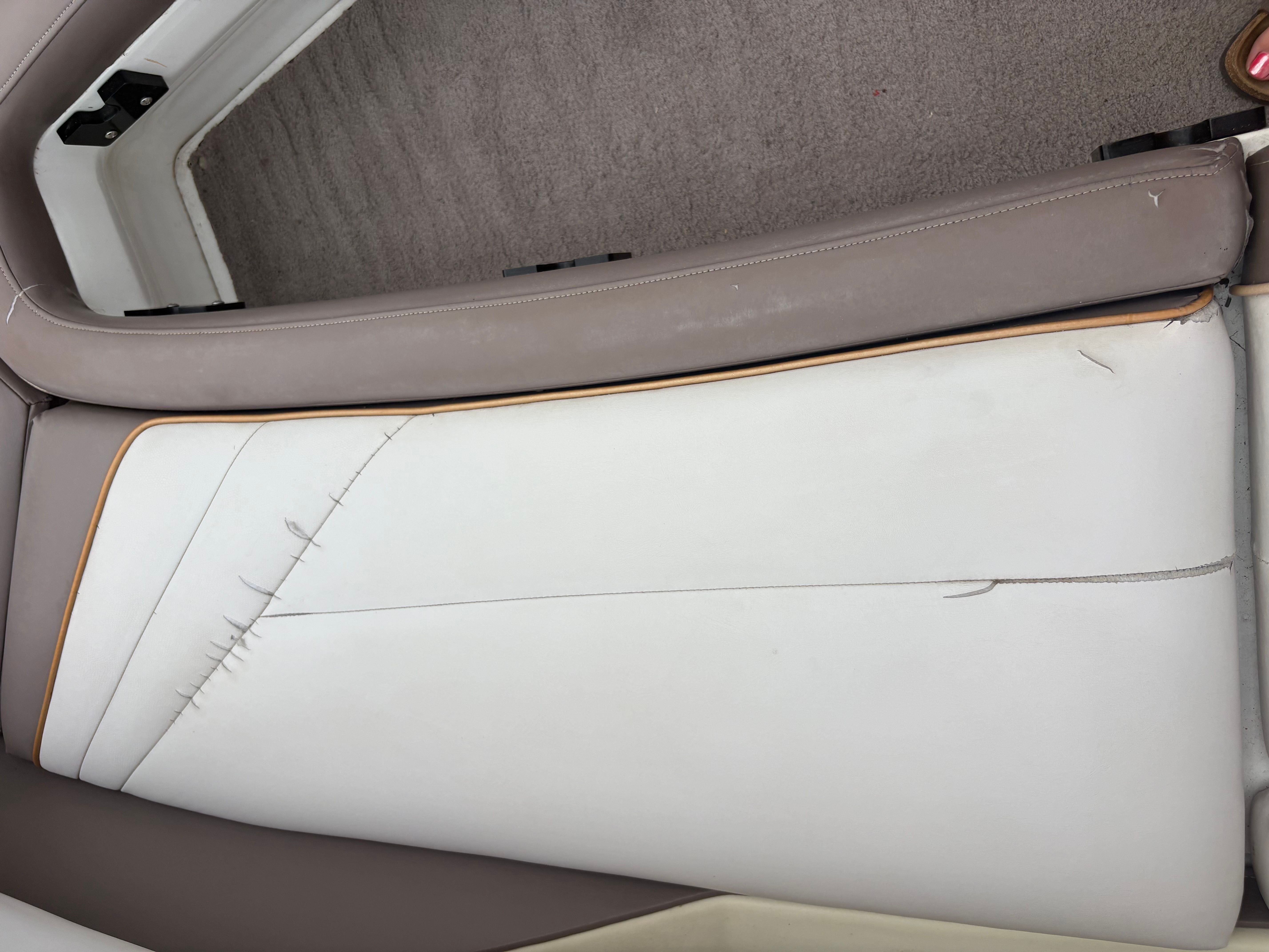 Damaged seat upholstery in a 1995 Cobalt 252 boat.