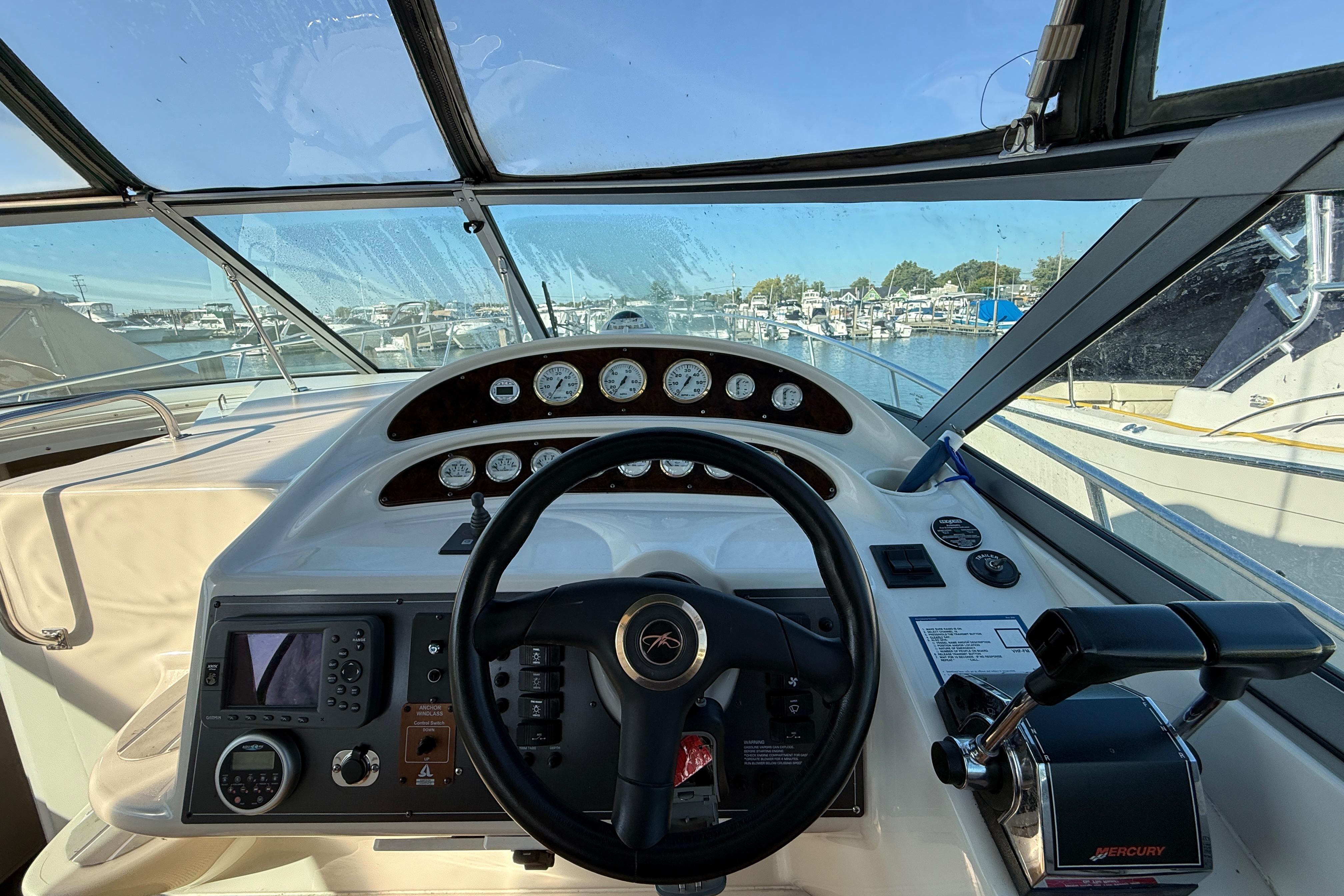 Cockpit view of 2000 Monterey 322 Cruiser with steering wheel and control panel.