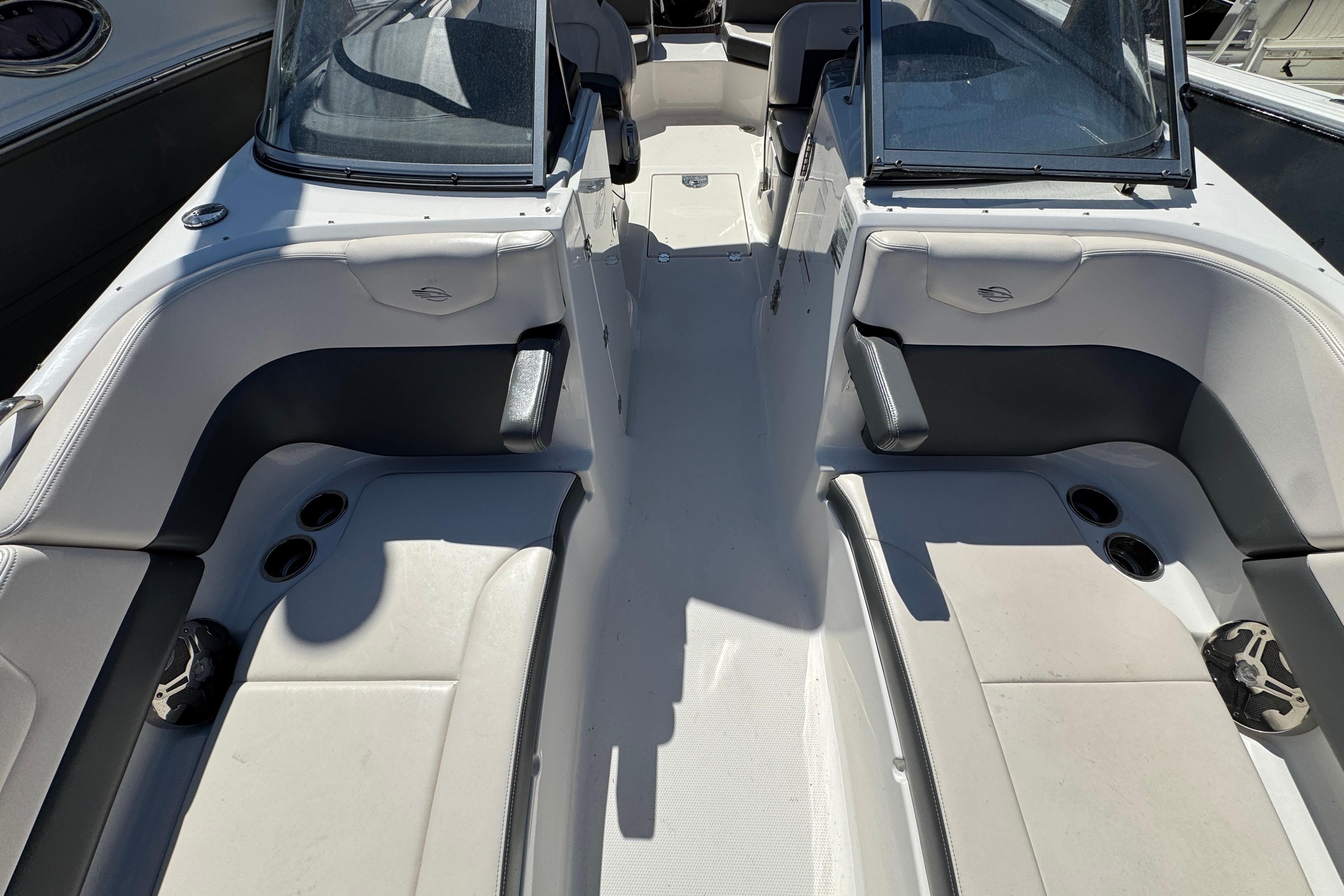 2018 Chaparral 250 Suncoast boat interior with seating and cup holders.