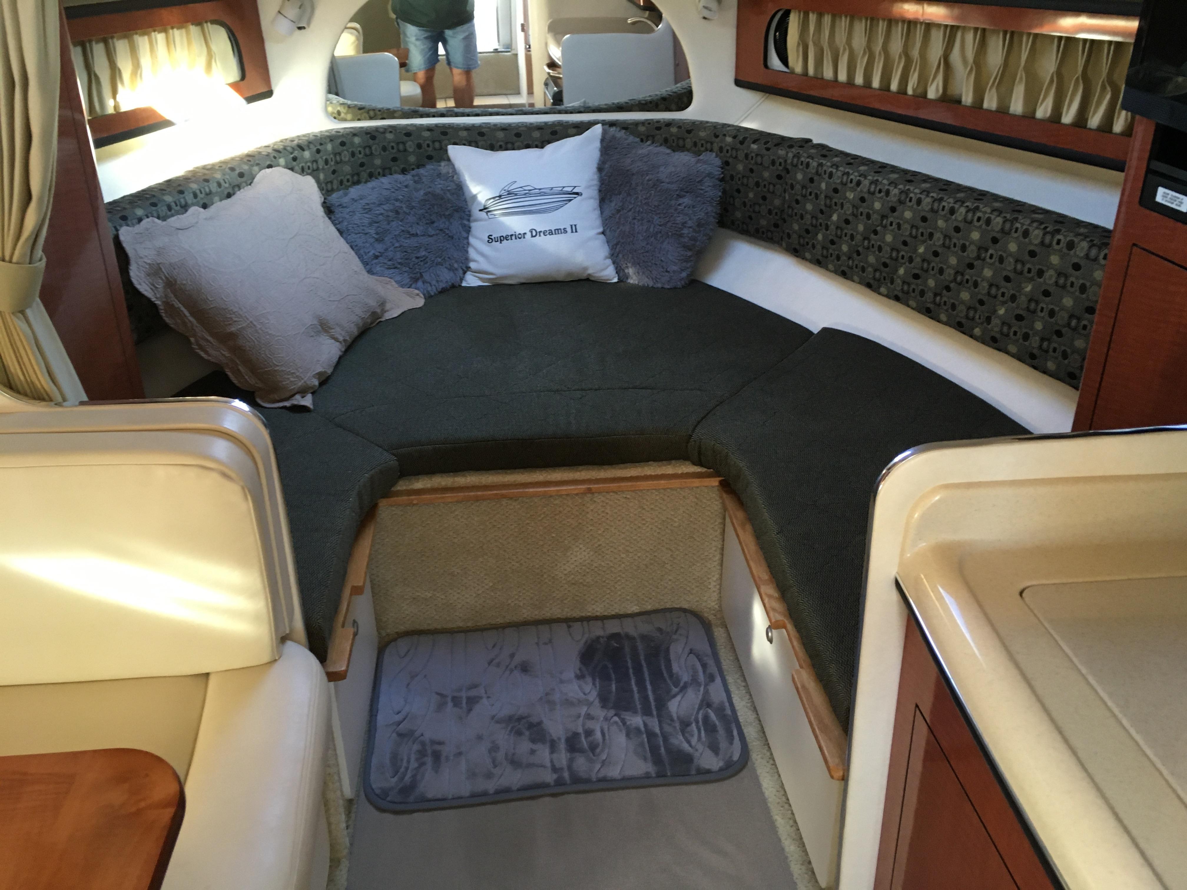 Interior of a 2005 Sea Ray Sundancer 280 yacht with cozy seating area.