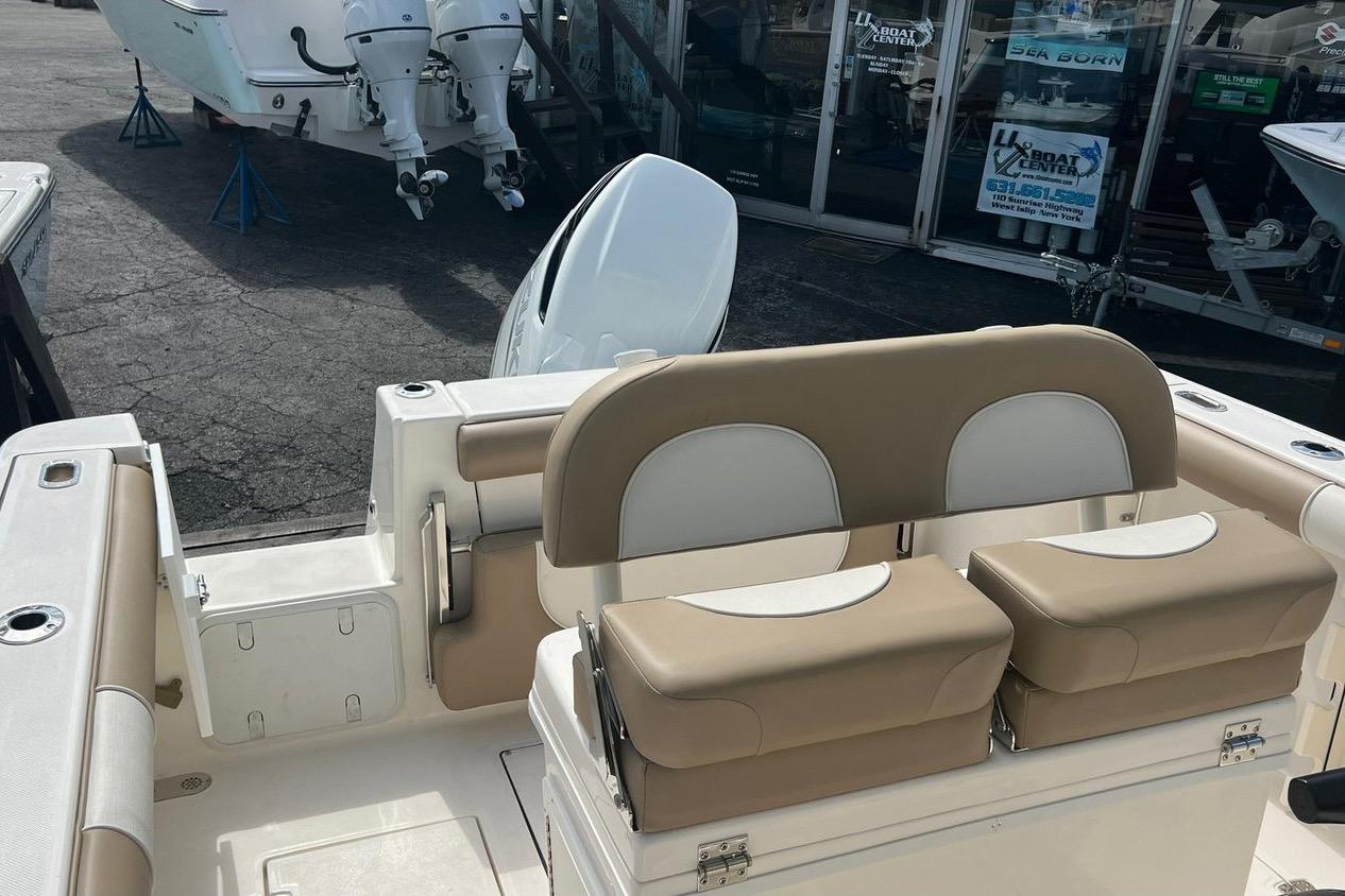 2023 Sea Born SX239 Offshore boat interior with dual seats and outboard motors.