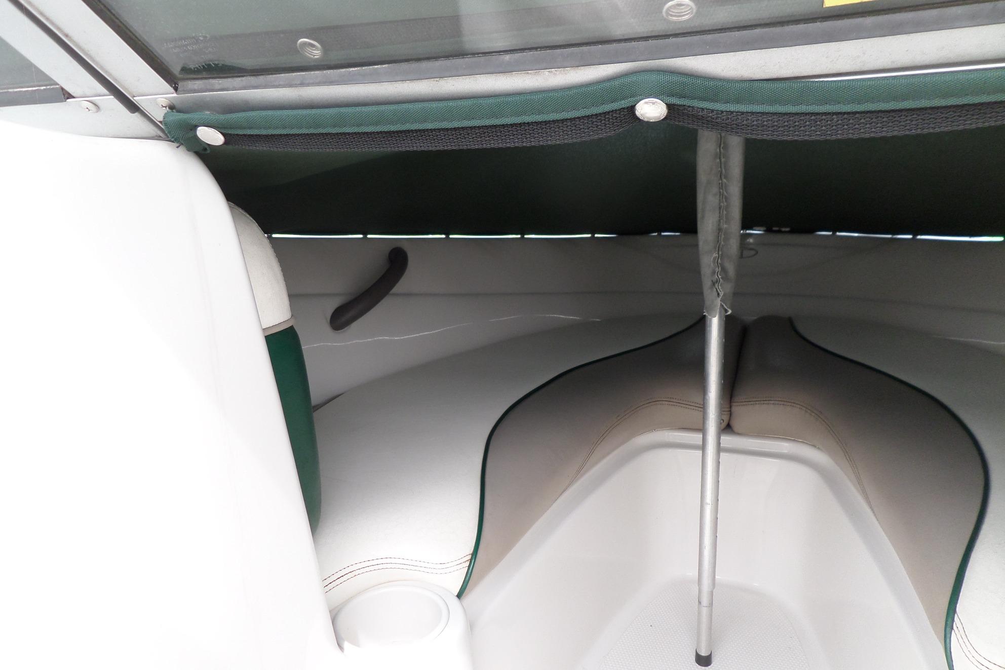 2005 Tahoe Q4 Sport boat interior with seating and canopy support pole.