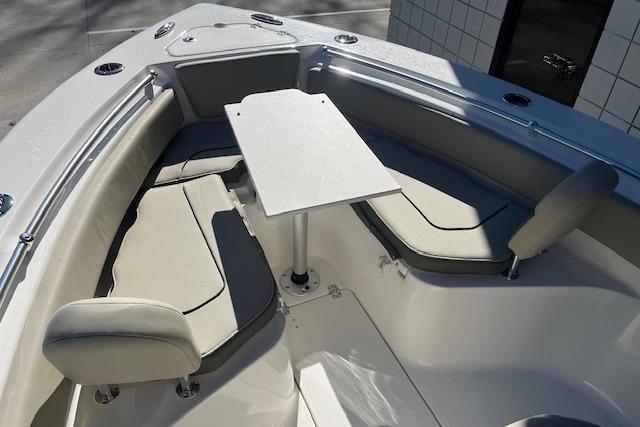 2026 Key West 239 FS boat interior with seating and table setup.