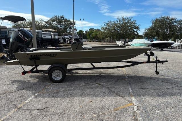 2026 Tracker Grizzly 1860 CC boat on trailer in outdoor lot.