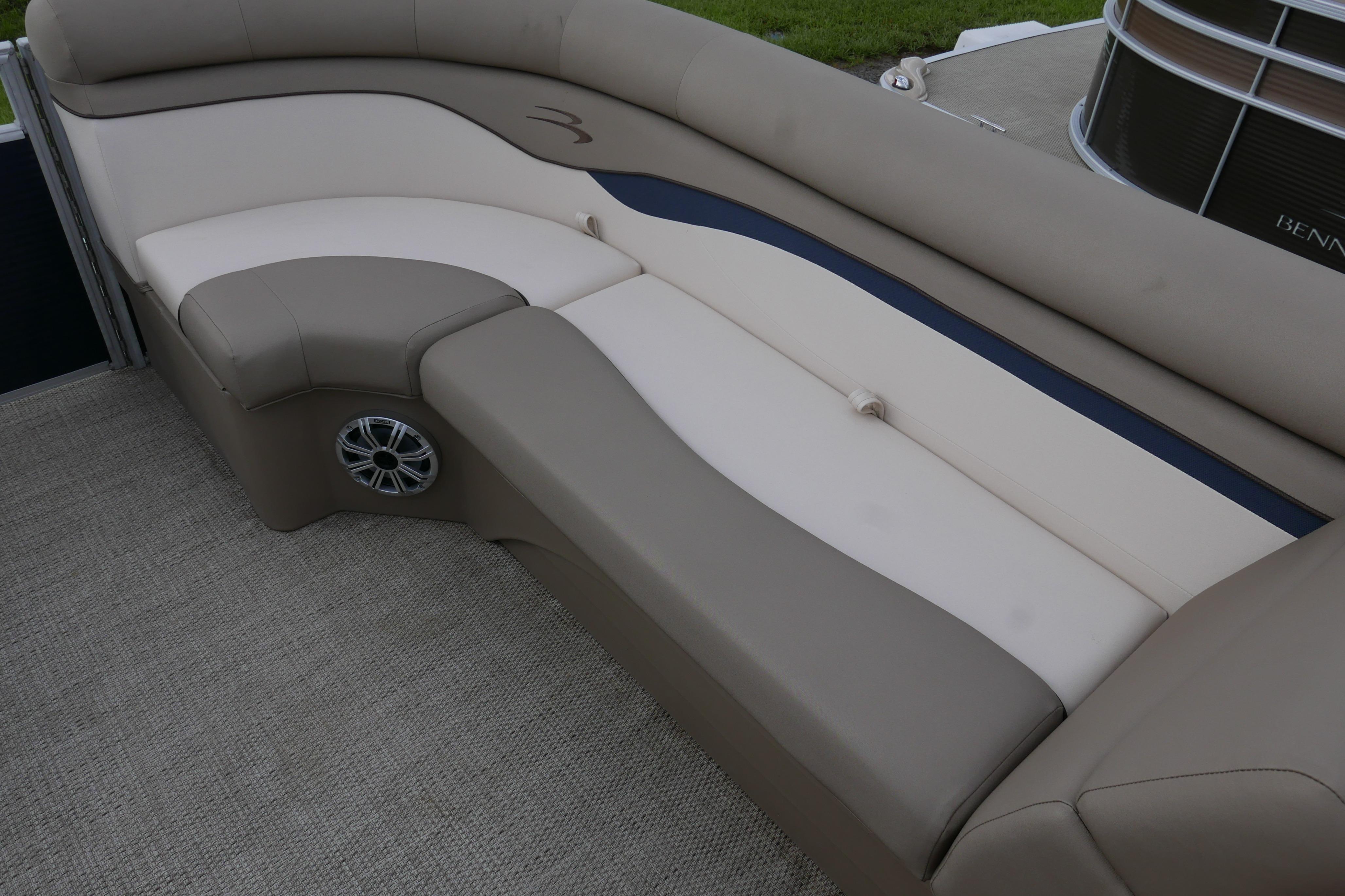 2019 Bennington SX 20 SLXP boat interior with beige seating and speaker detail.