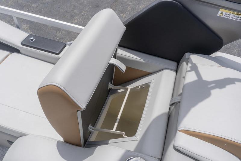 2026 SunCatcher Elite 326 SS boat seat with open storage compartment.