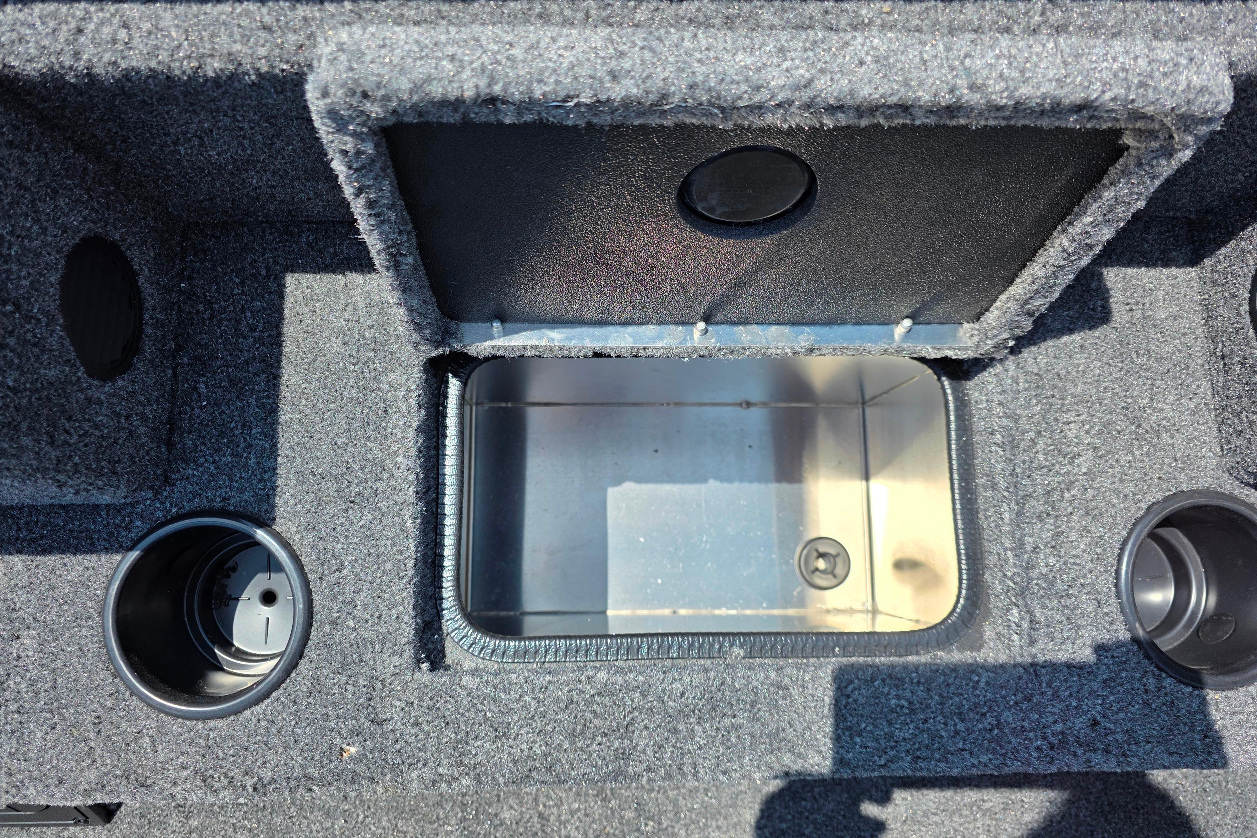 2026 Tracker Pro Team 195 boat storage compartment with open lid and cup holders.