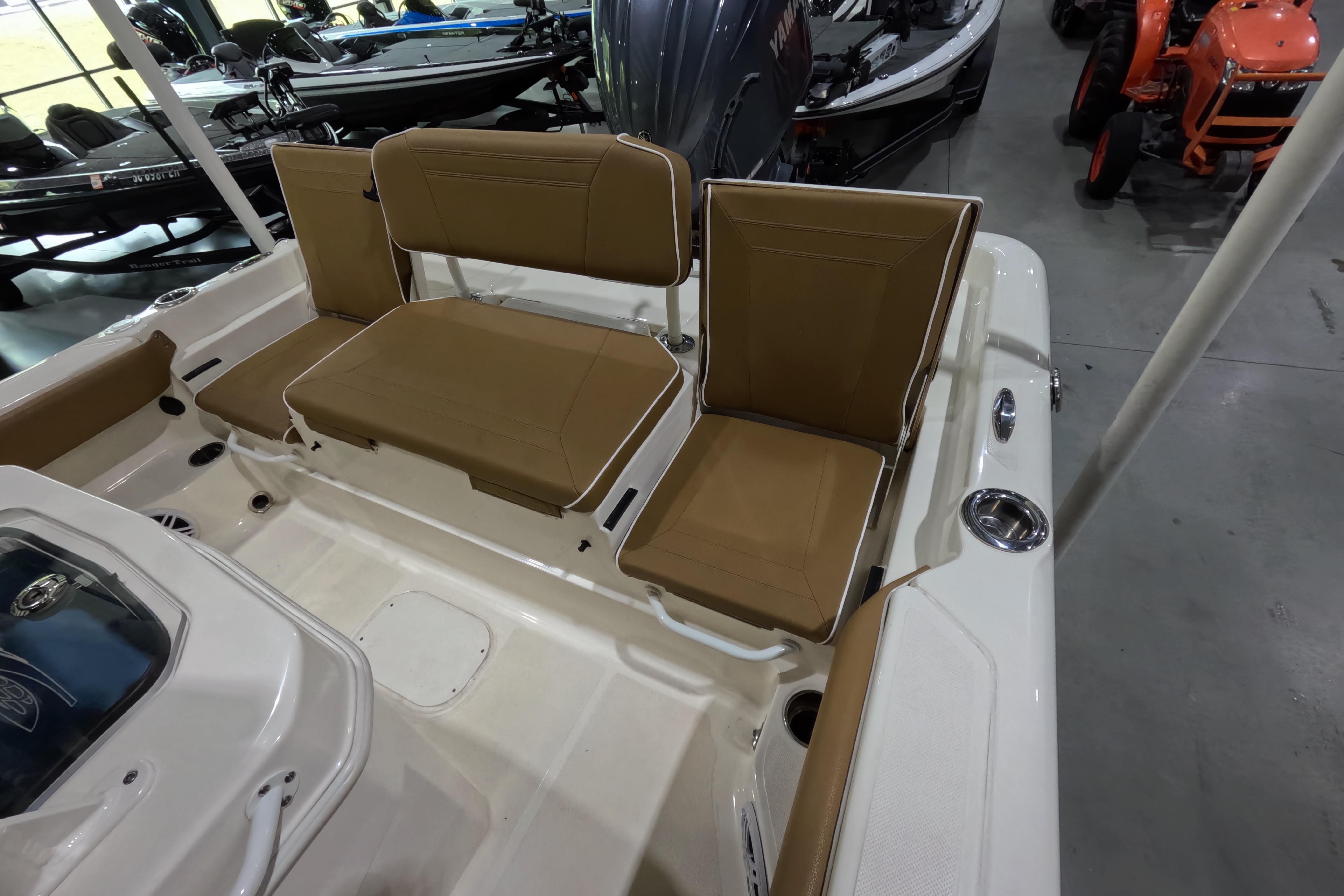 2024 Skeeter SX2550 Family boat interior with tan seating and white deck.