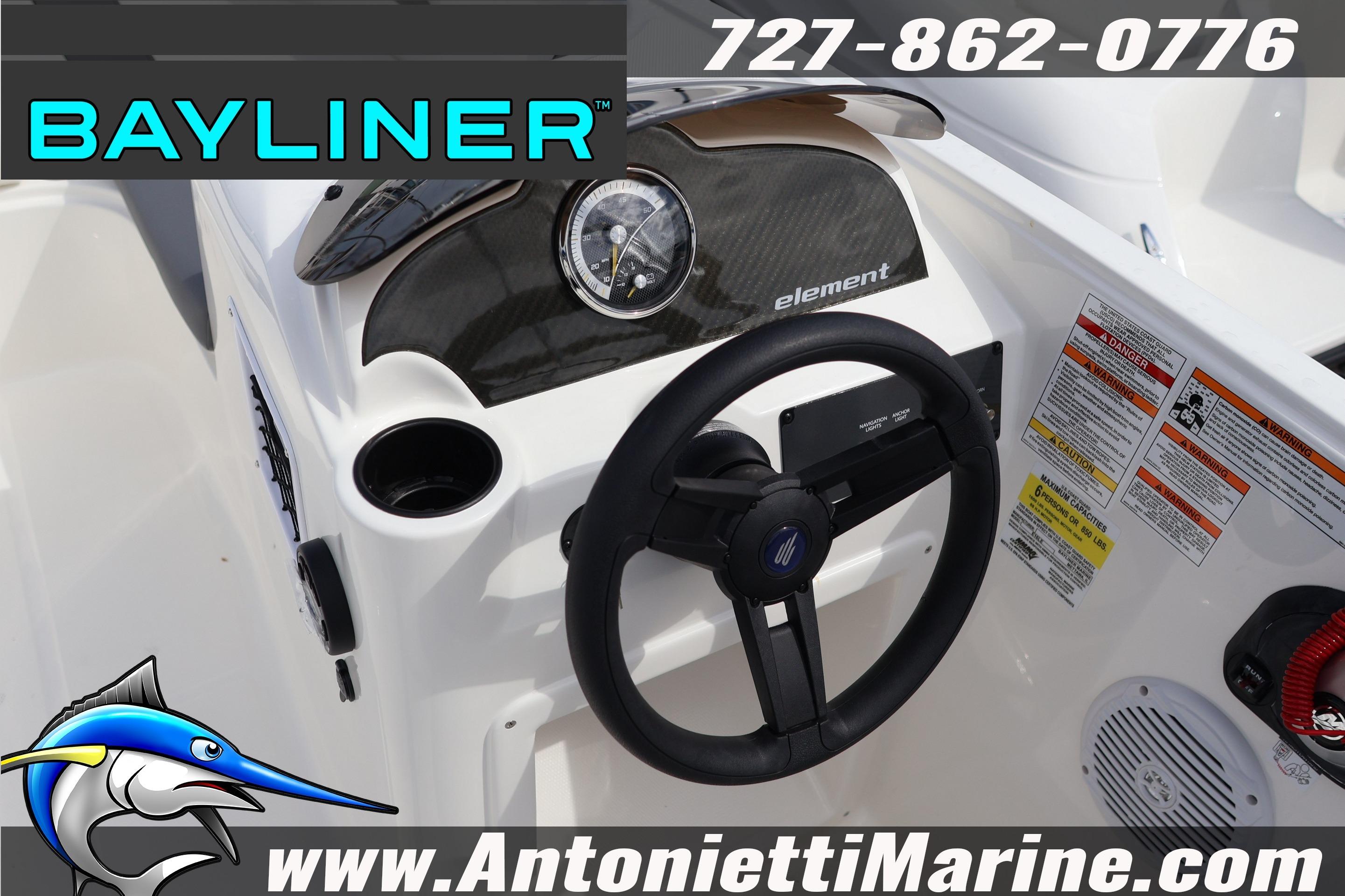 2026 Bayliner Element E16 dashboard with steering wheel and control panel, featuring safety labels.