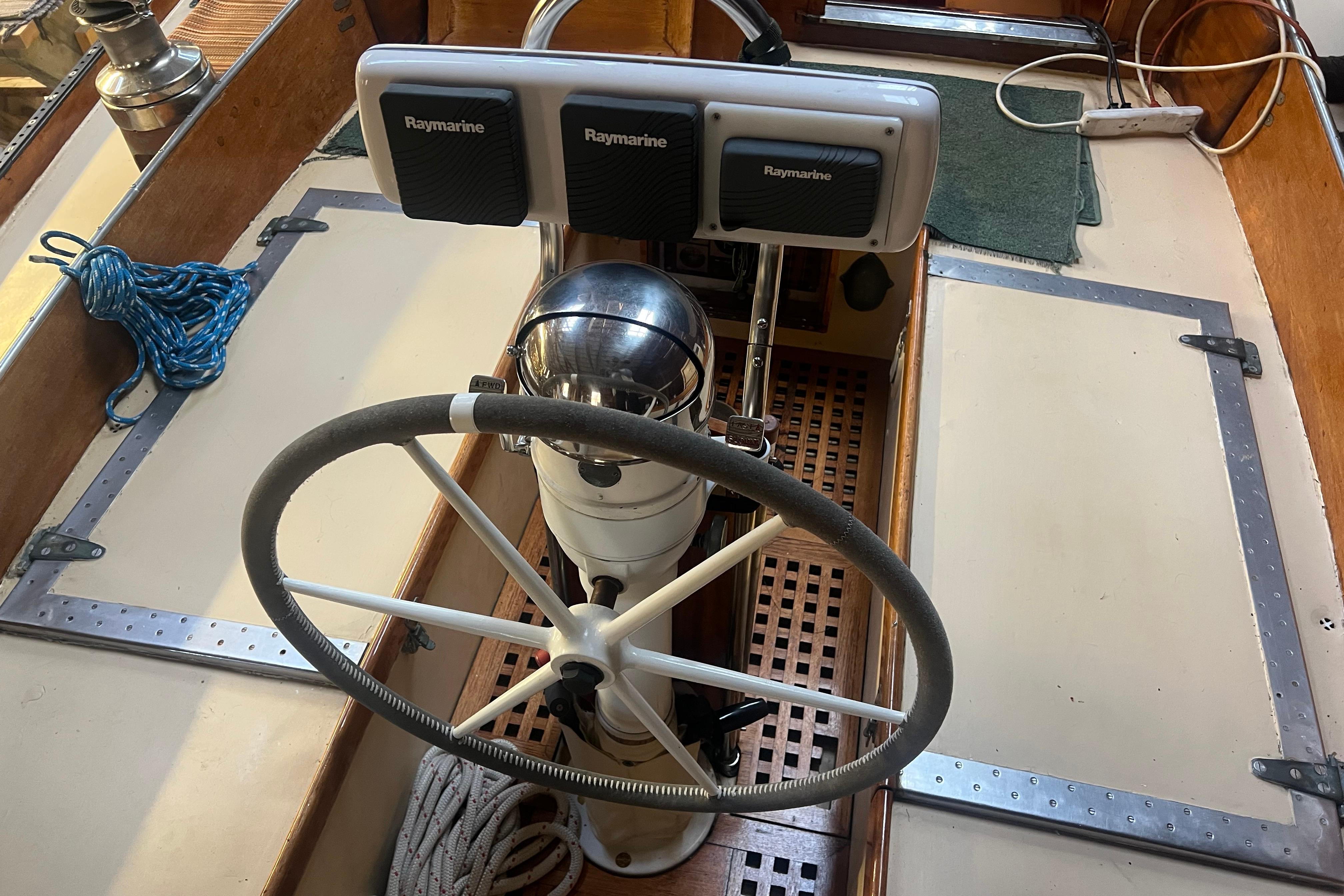 Steering wheel and navigation equipment on 1962 Ted Hood Little Harbor 40 Yawl.