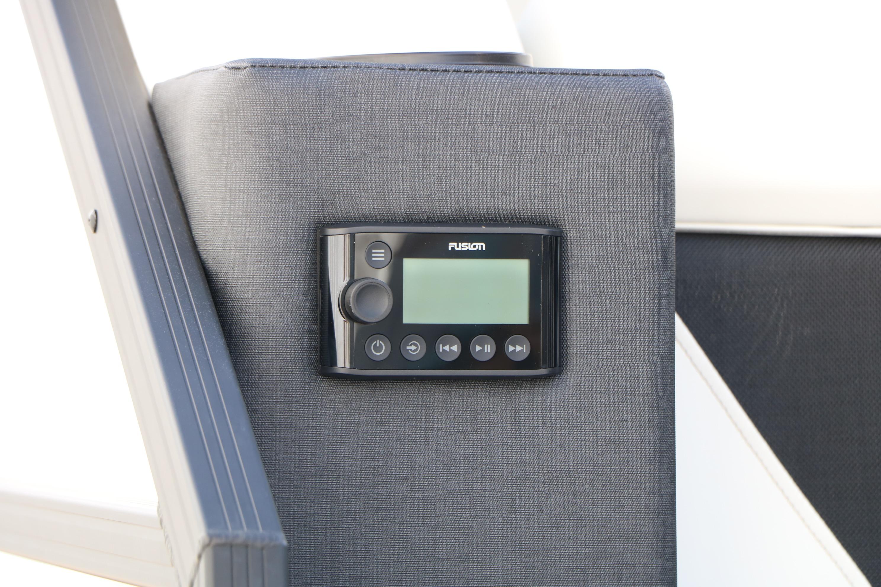 Control panel on 2026 Evotti 725 CS Tri-Toon boat, featuring Fusion audio system.