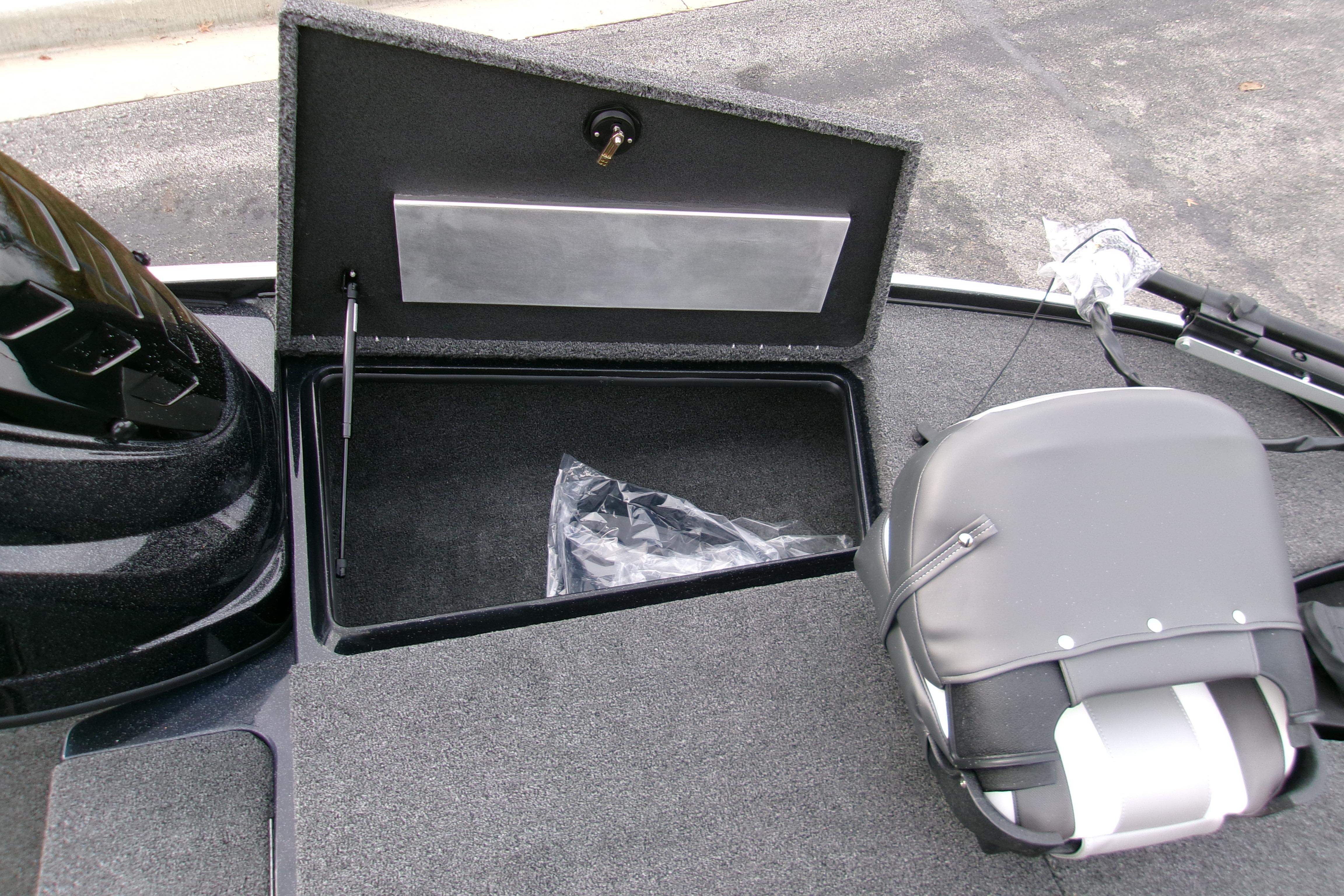 2026 Nitro Z17 boat storage compartment with open lid and seat detail.