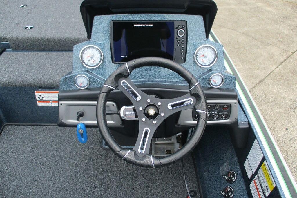 Nitro Z19 Pro 2020 boat dashboard with steering wheel and control panel.