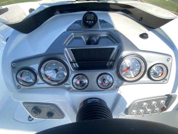 2024 Tahoe 2150 boat dashboard with gauges and controls.