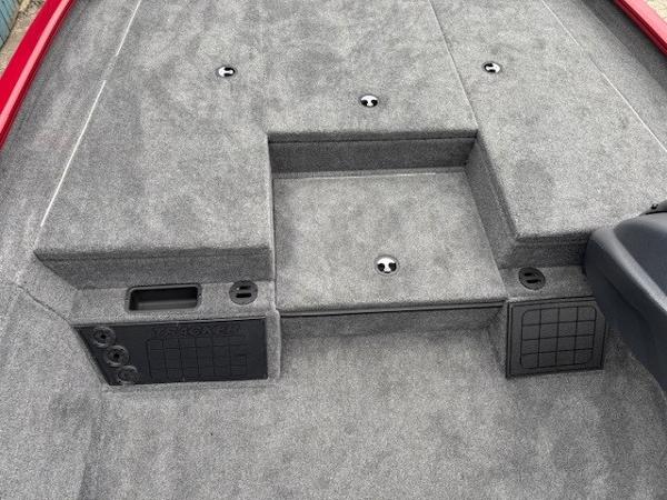 2025 Tracker Savage 215 boat deck with gray carpeting and storage compartments.